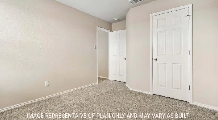 Carpeted flooring, neutral wall tones, white trim, and white paneled doors
