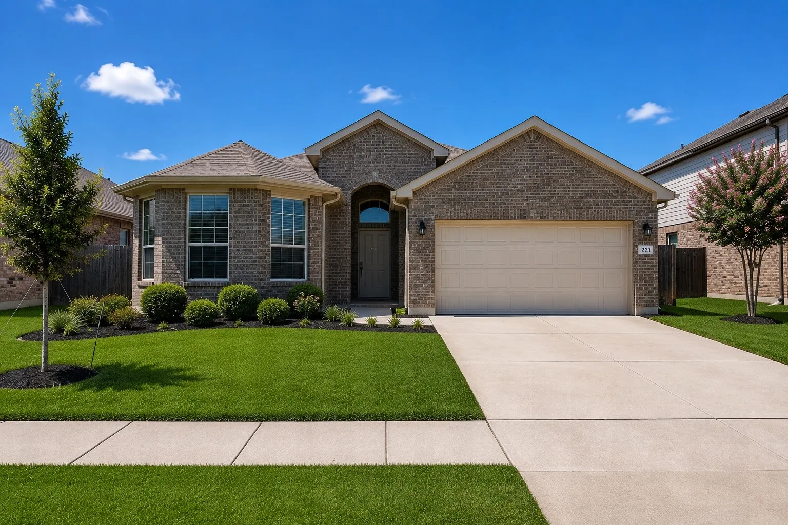 Brick exterior with a prominent arched entry
