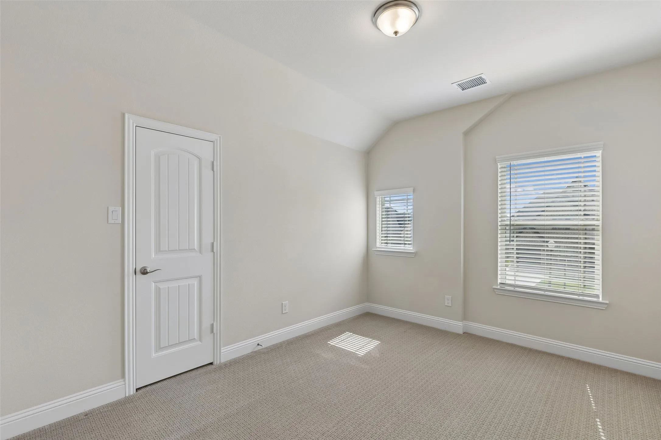 Level 2, bedroom 2 featuring carpet, a walk in closet and natural light.