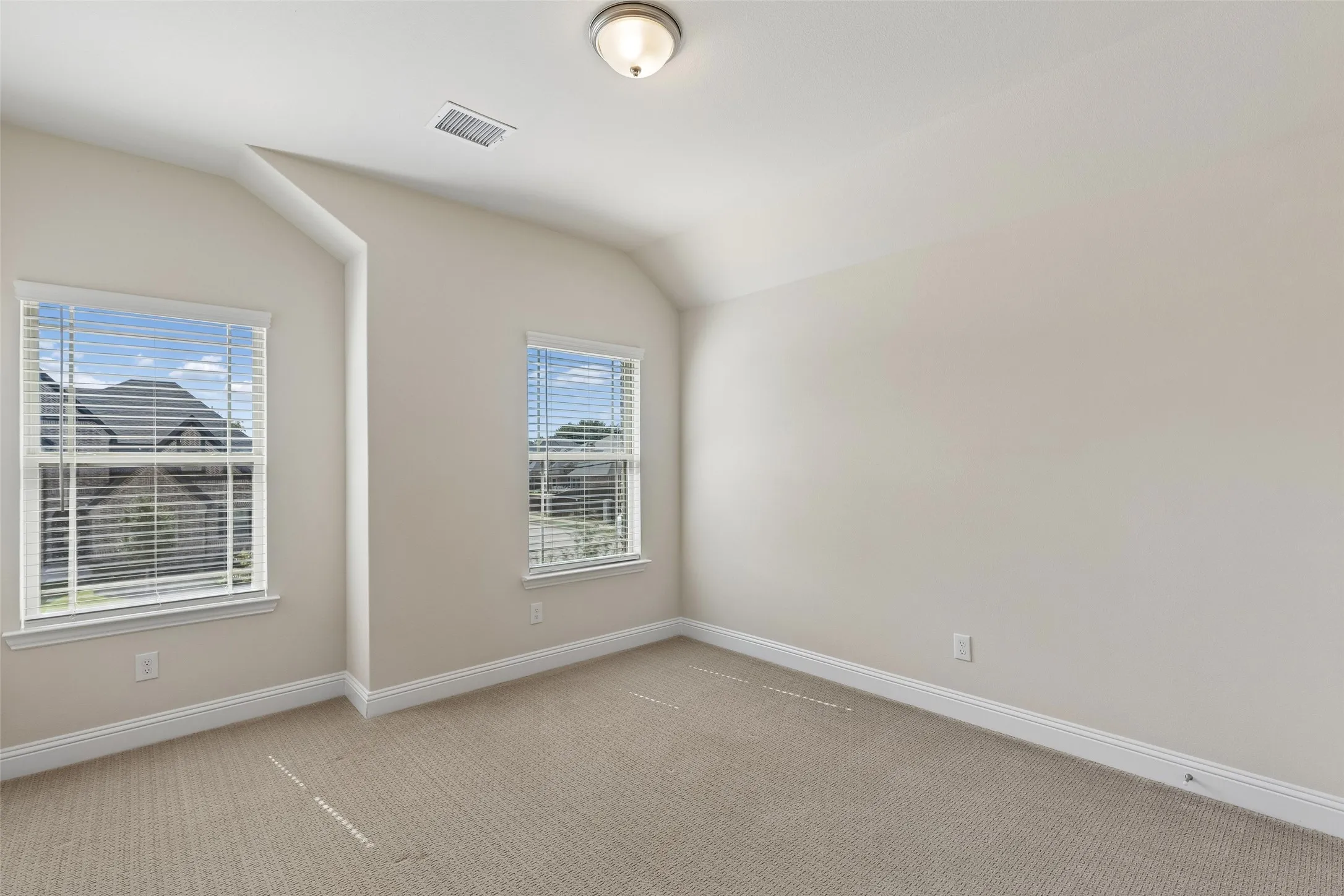 Level 2, bedroom 3 featuring carpet, a walk in closet and natural light.