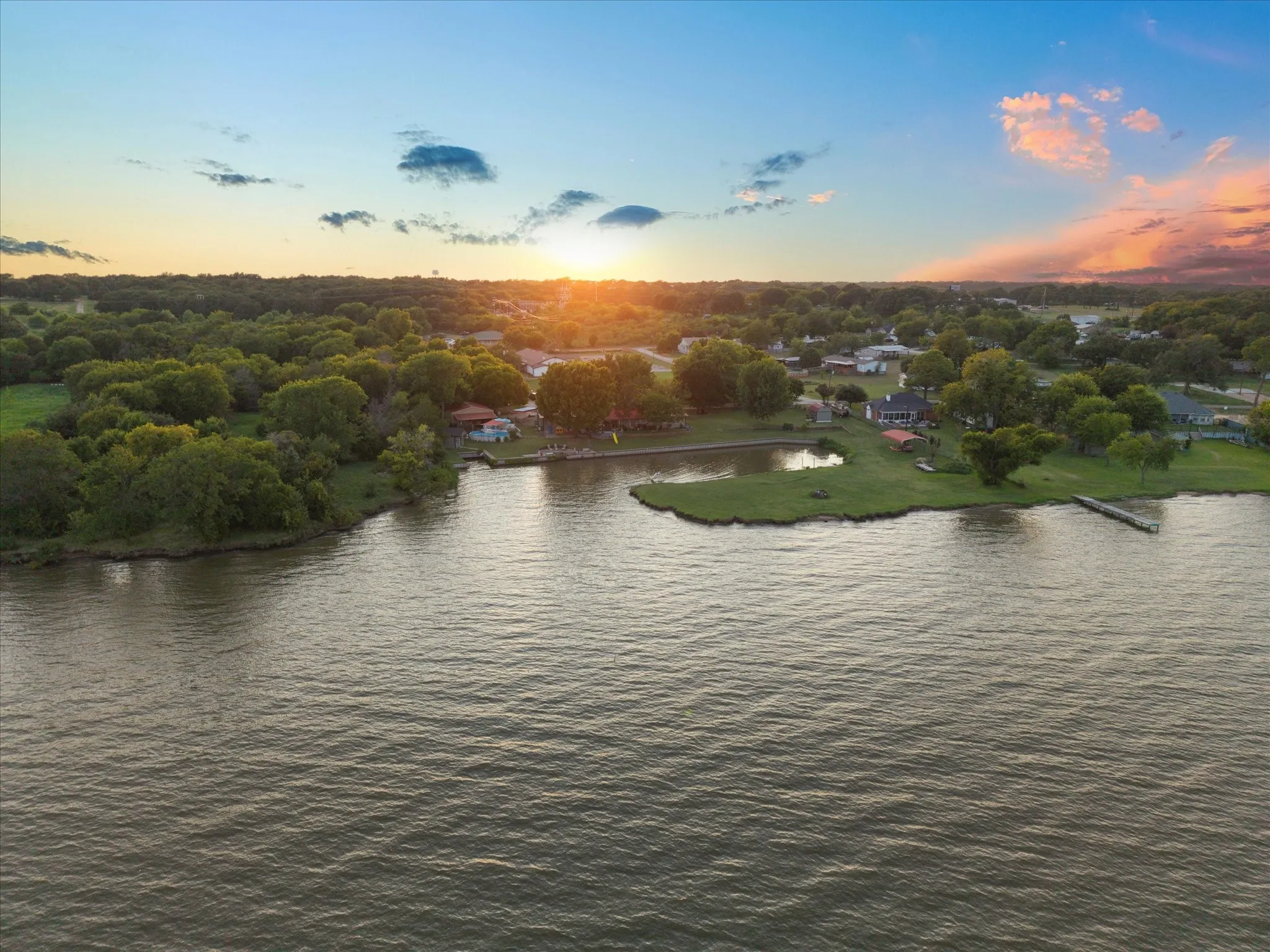 Waterfront property featuring a private dock and a secondary pond