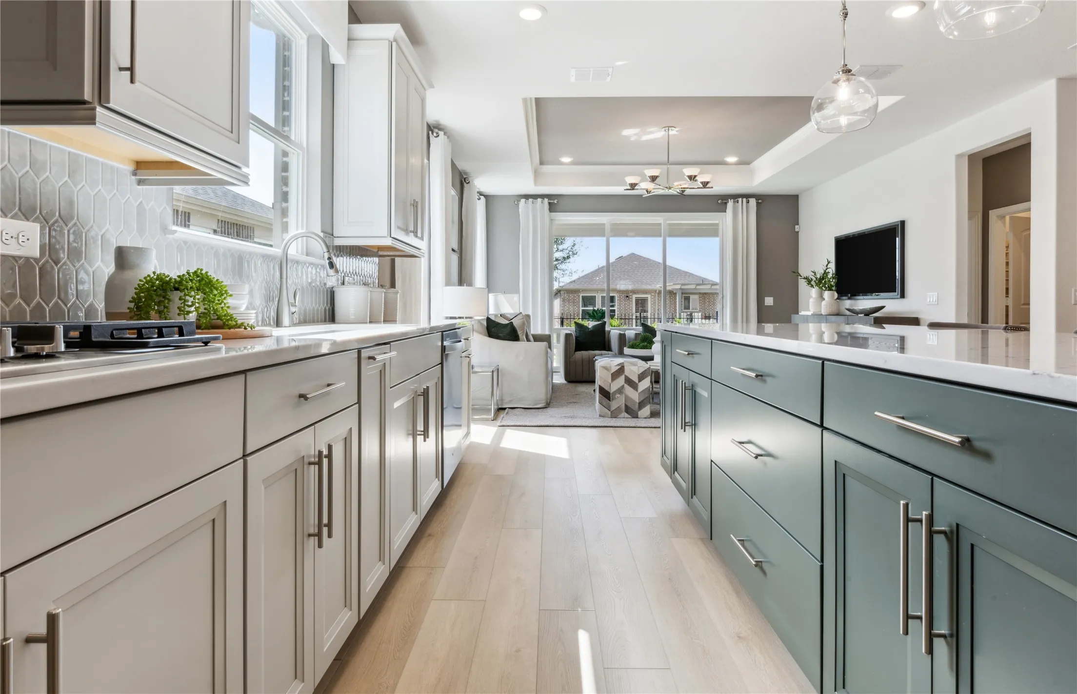 *Model Representation - Large island overlooking gathering room and dining areas