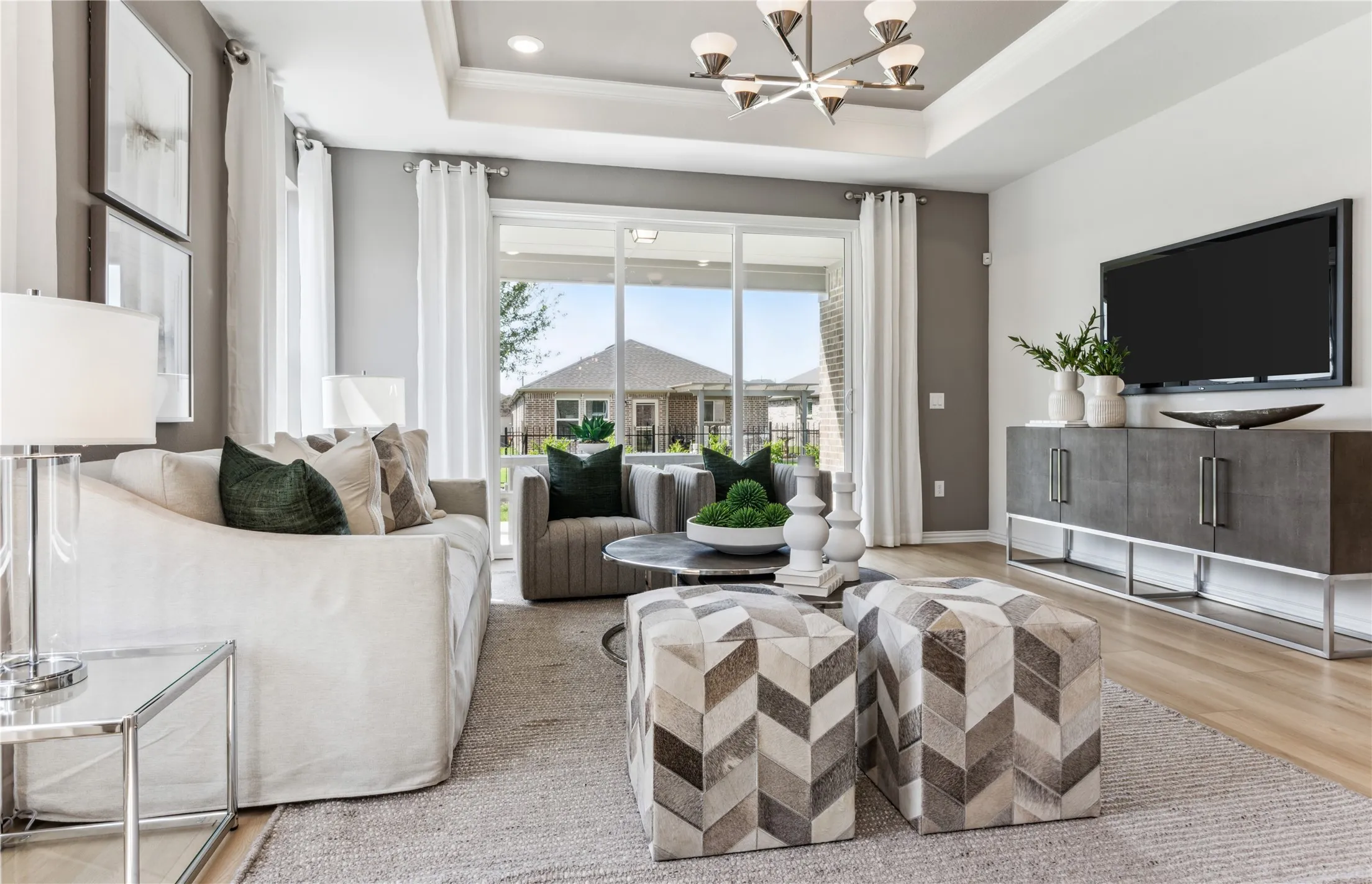 *Model Representation - Spacious gathering room with large windows