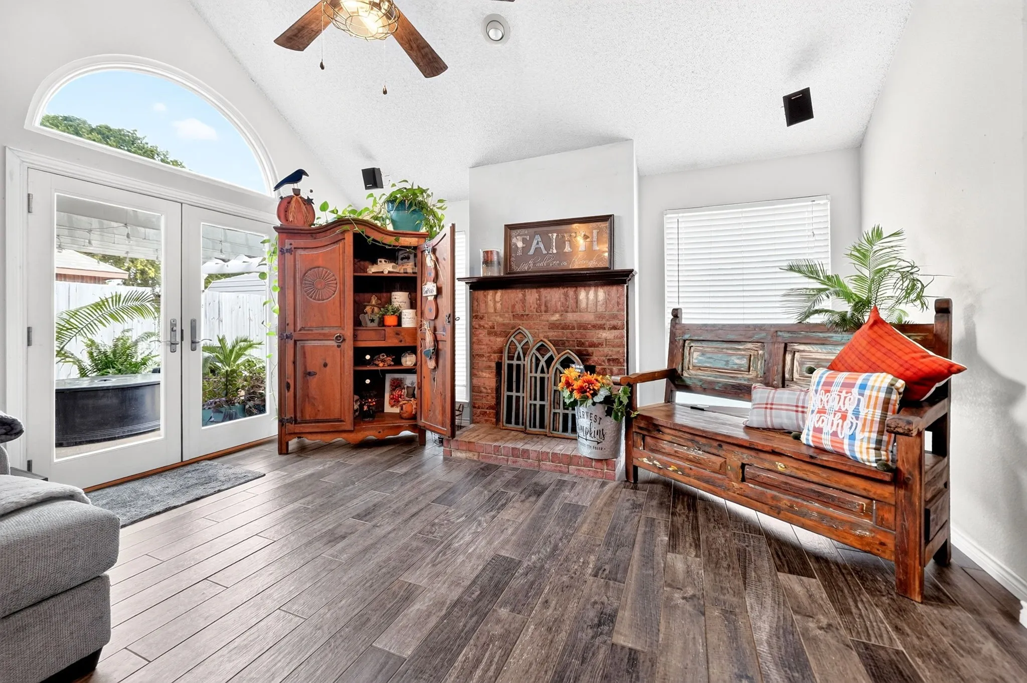 Wood Burning Fireplace and French Doors that lead to the pergola!