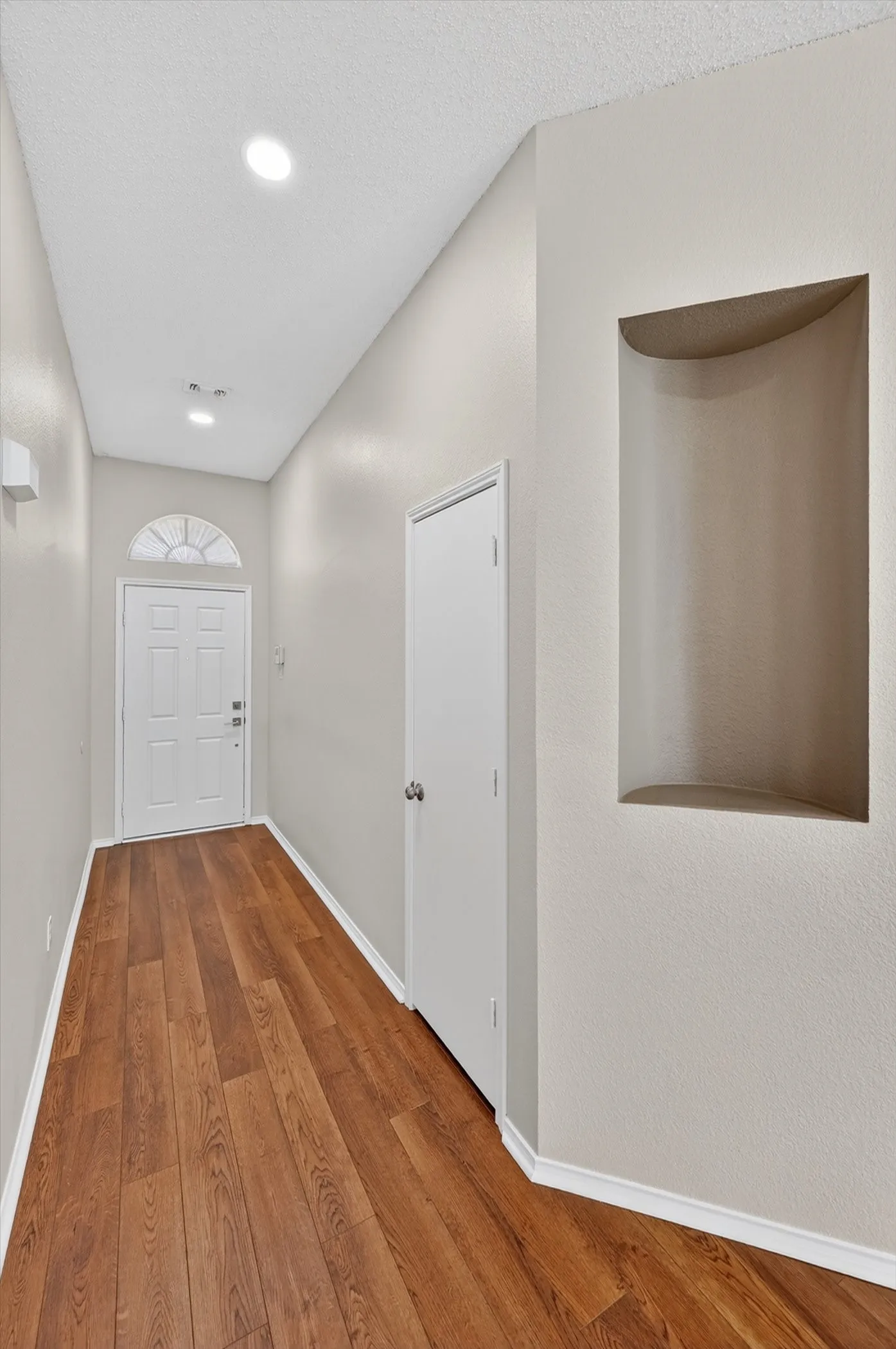 Wood-finish flooring throughout the entryway
