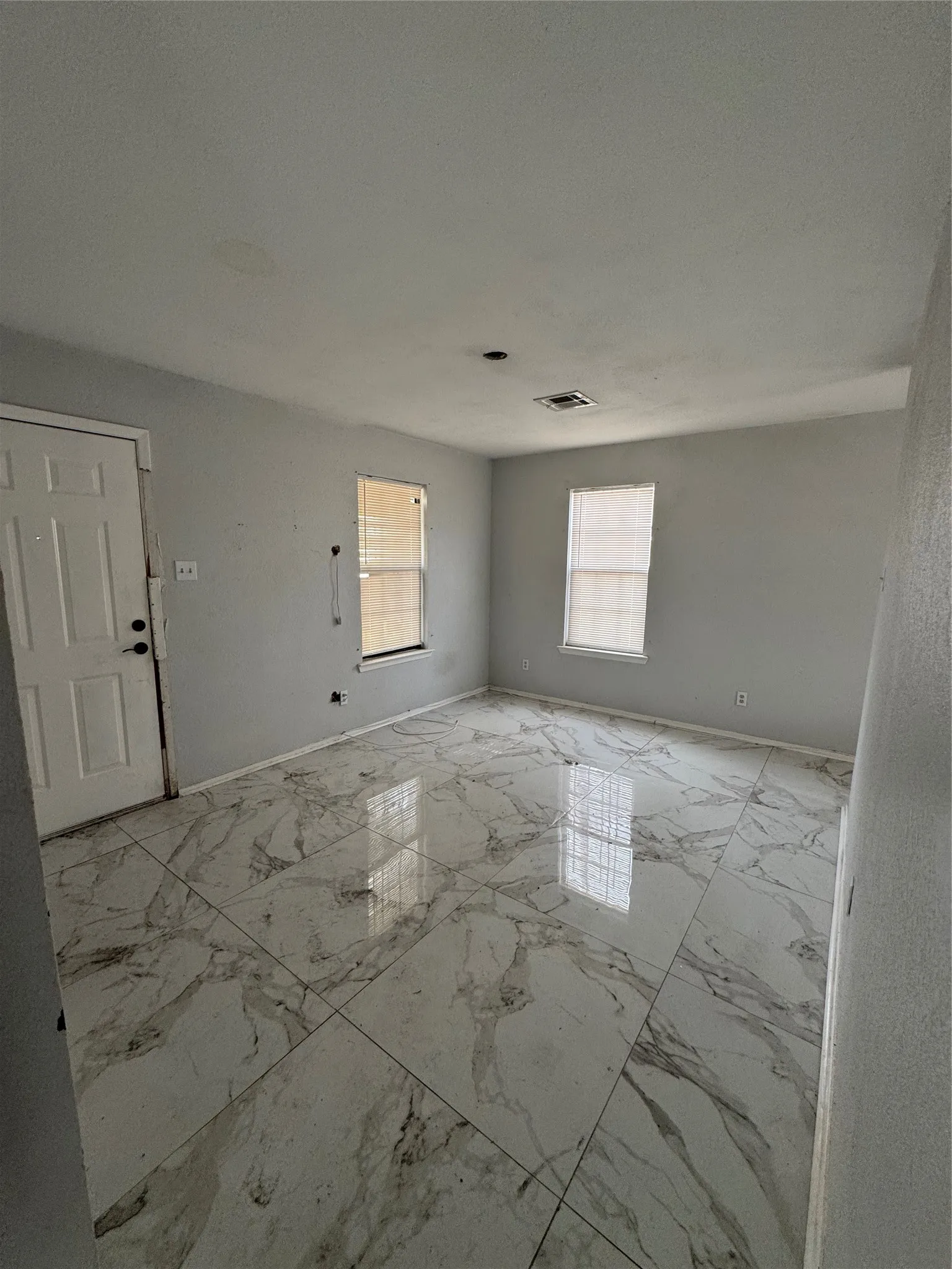 Large format tile flooring with a marble-effect finish