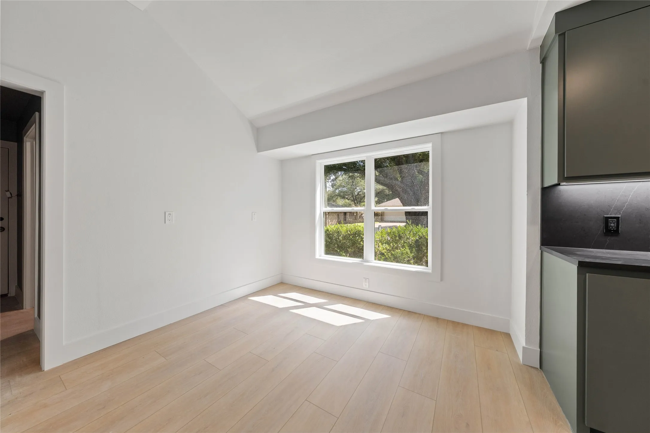 Installed soon: a natural wood wrapped beam, light fixtures, and kitchen cabinetry hardware