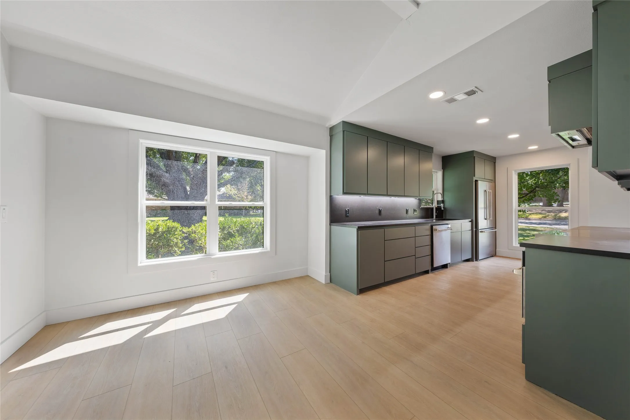 Installed soon: a natural wood wrapped beam, light fixtures, and kitchen cabinetry hardware