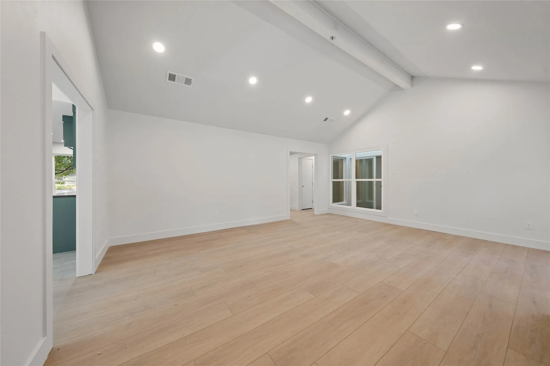 Installed soon: a custom fireplace, light fixtures, and natural wooden ceiling beam
