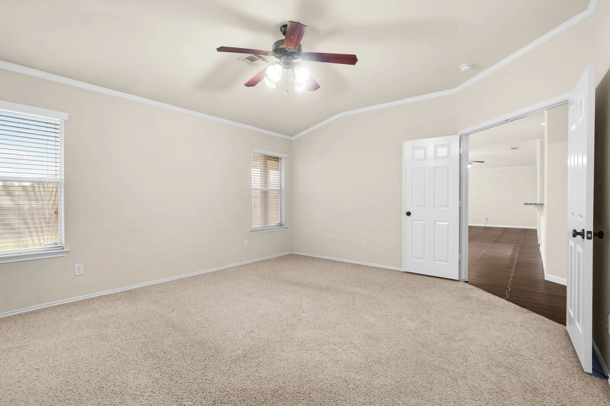 Neutral-toned carpeting paired with light wall finishes