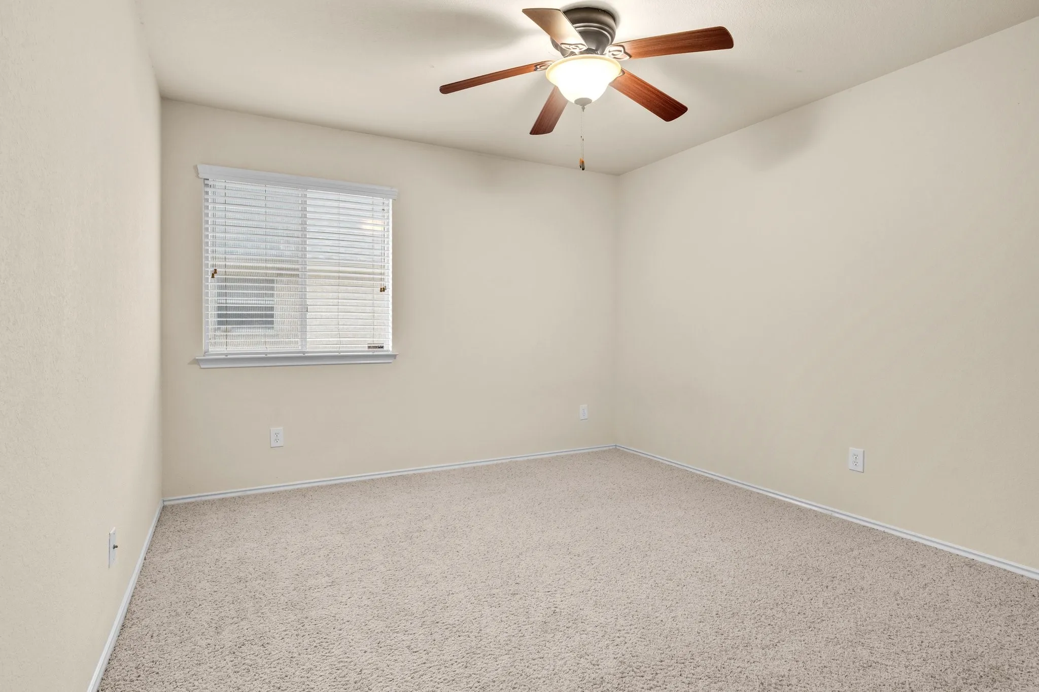 Neutral-toned carpeting paired with light walls