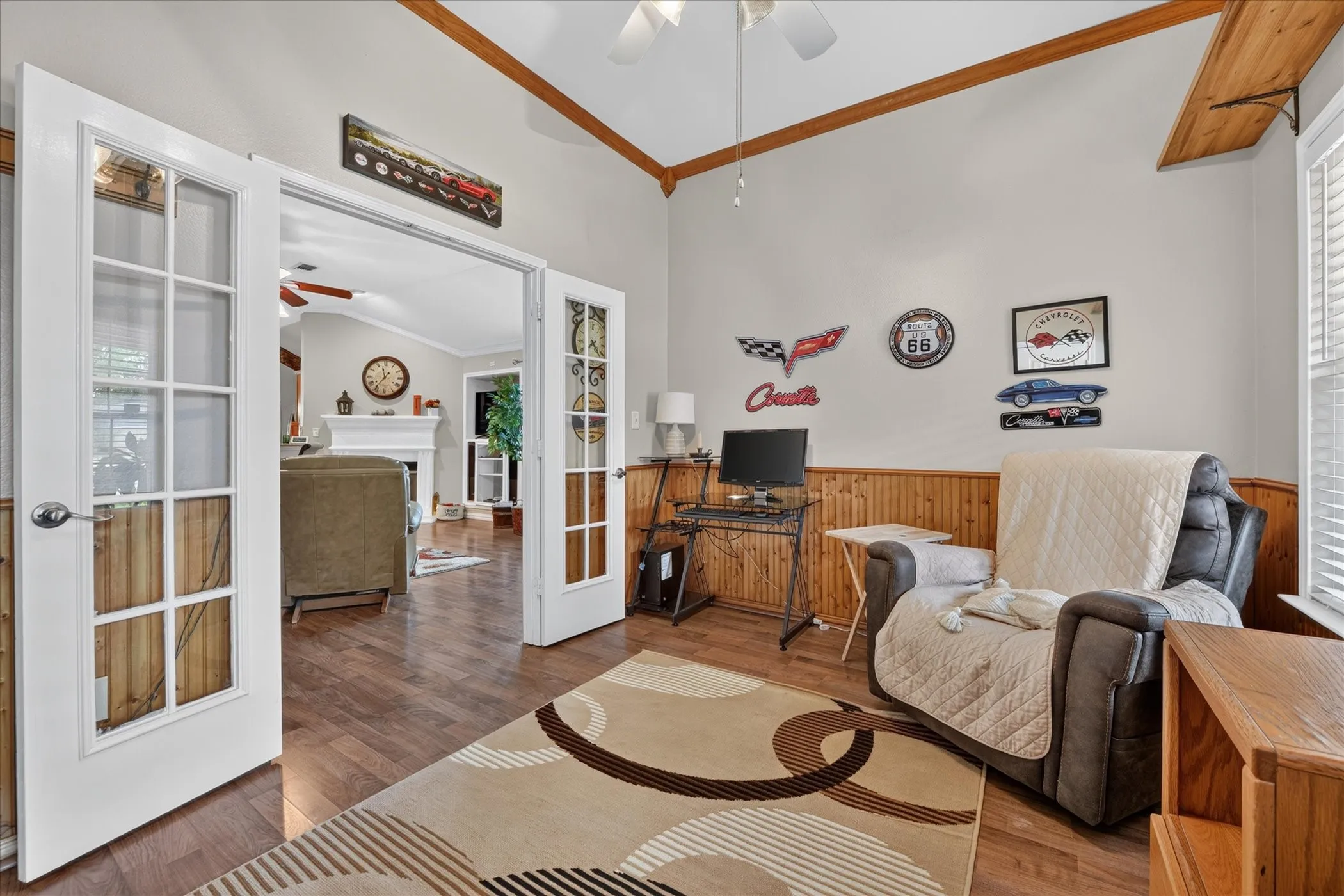 Wood-finish flooring with wainscoting and natural wood ceiling beams