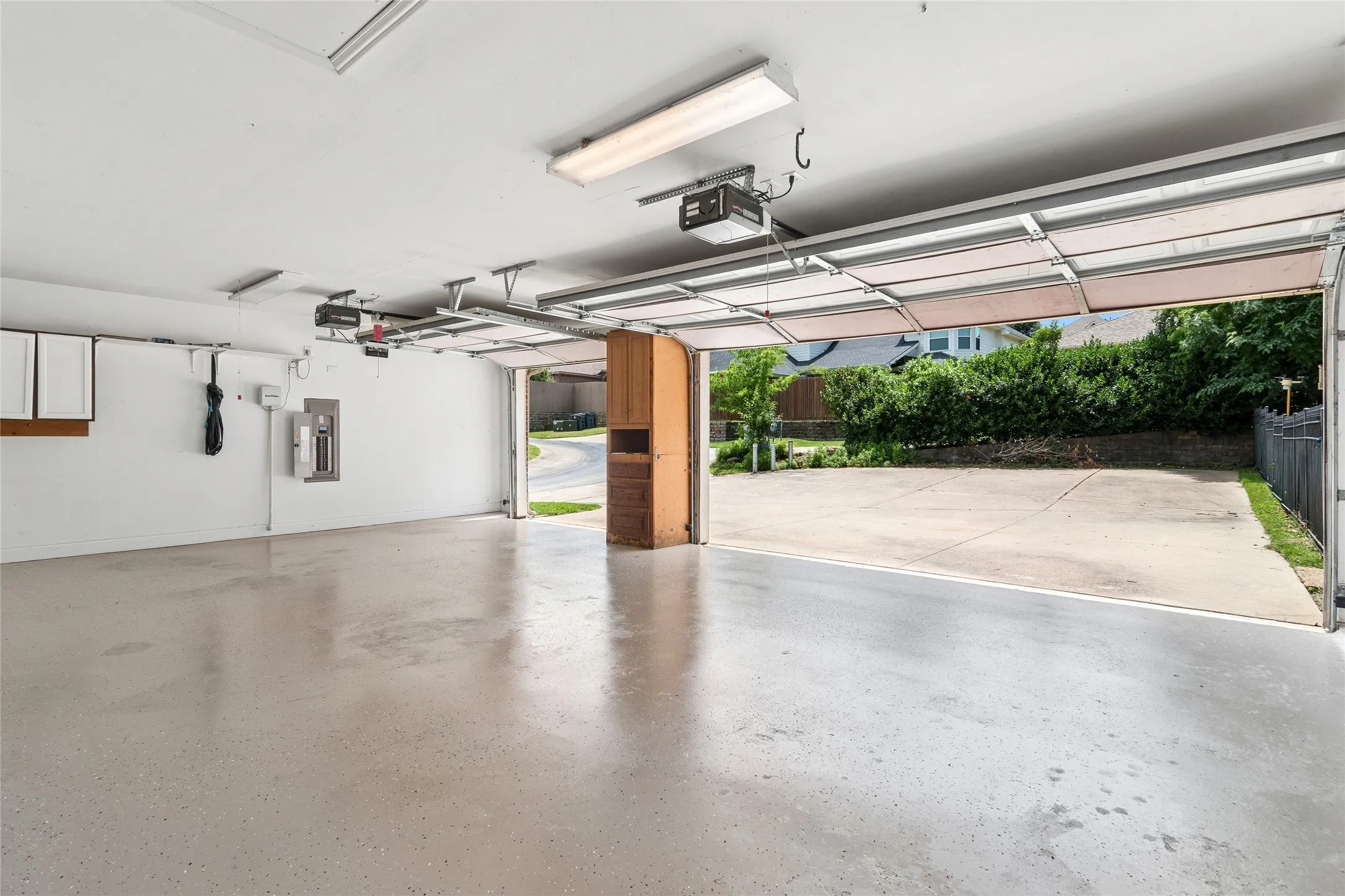 3 Car garage with expoxy flooring-oversized driveway