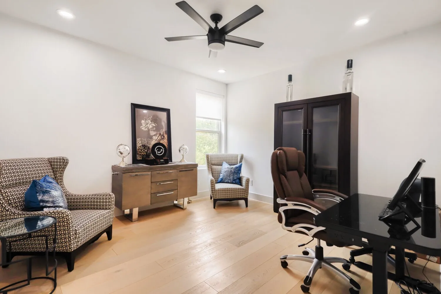 Set Up as working from home office - Recessed lighting, ceiling fan, wood-finish flooring, and a window with a roller shade