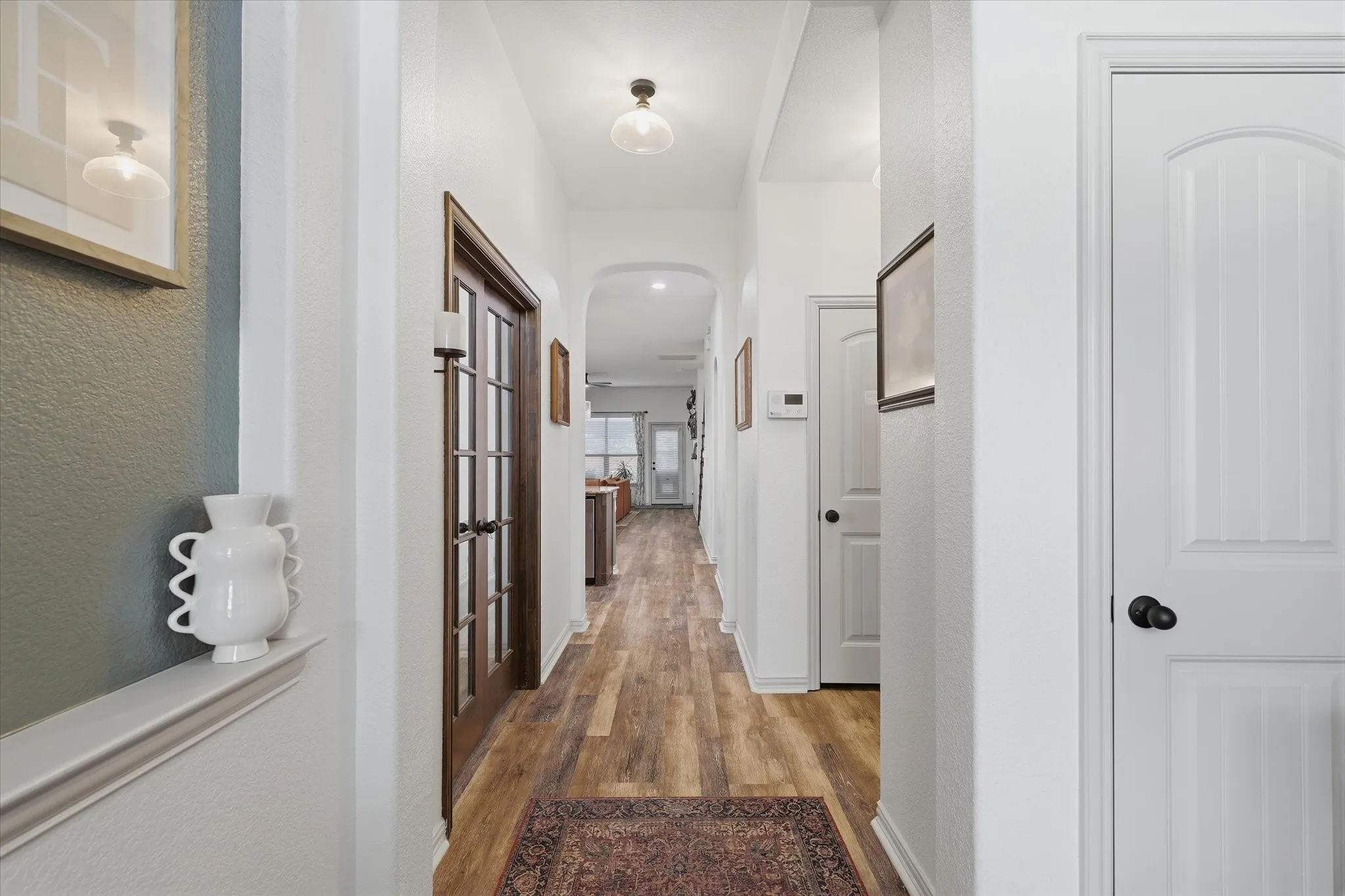 Entryway features beadboard wall and wood ceiling finish out.