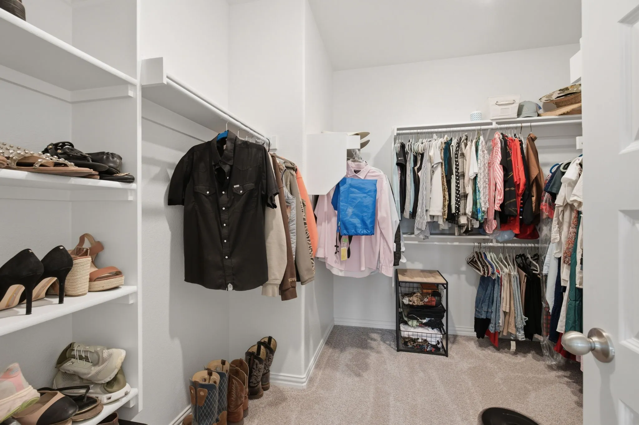 Generous walk-in primary closet with built-in shelving, hanging space, and room for an organized wardrobe. A must-have feature buyers love.
