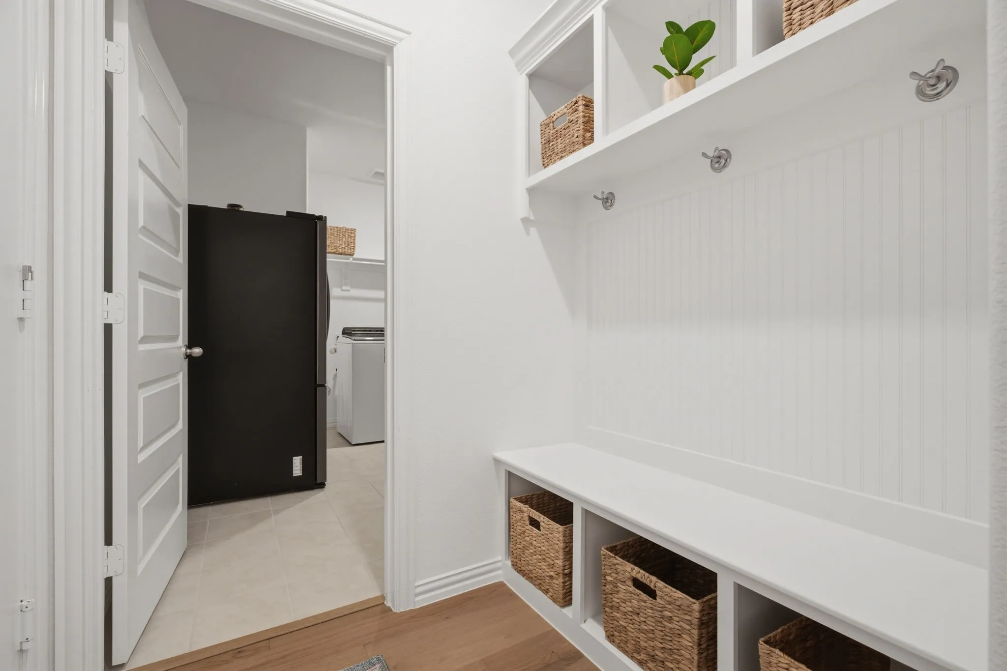 Built-in mudroom/drop zone with bench, hooks, cubbies, and extra storage keeps everyday life organized. Conveniently located near the laundry room, this is a buyer-loved feature in 905 Bluebell St in Princeton, TX.