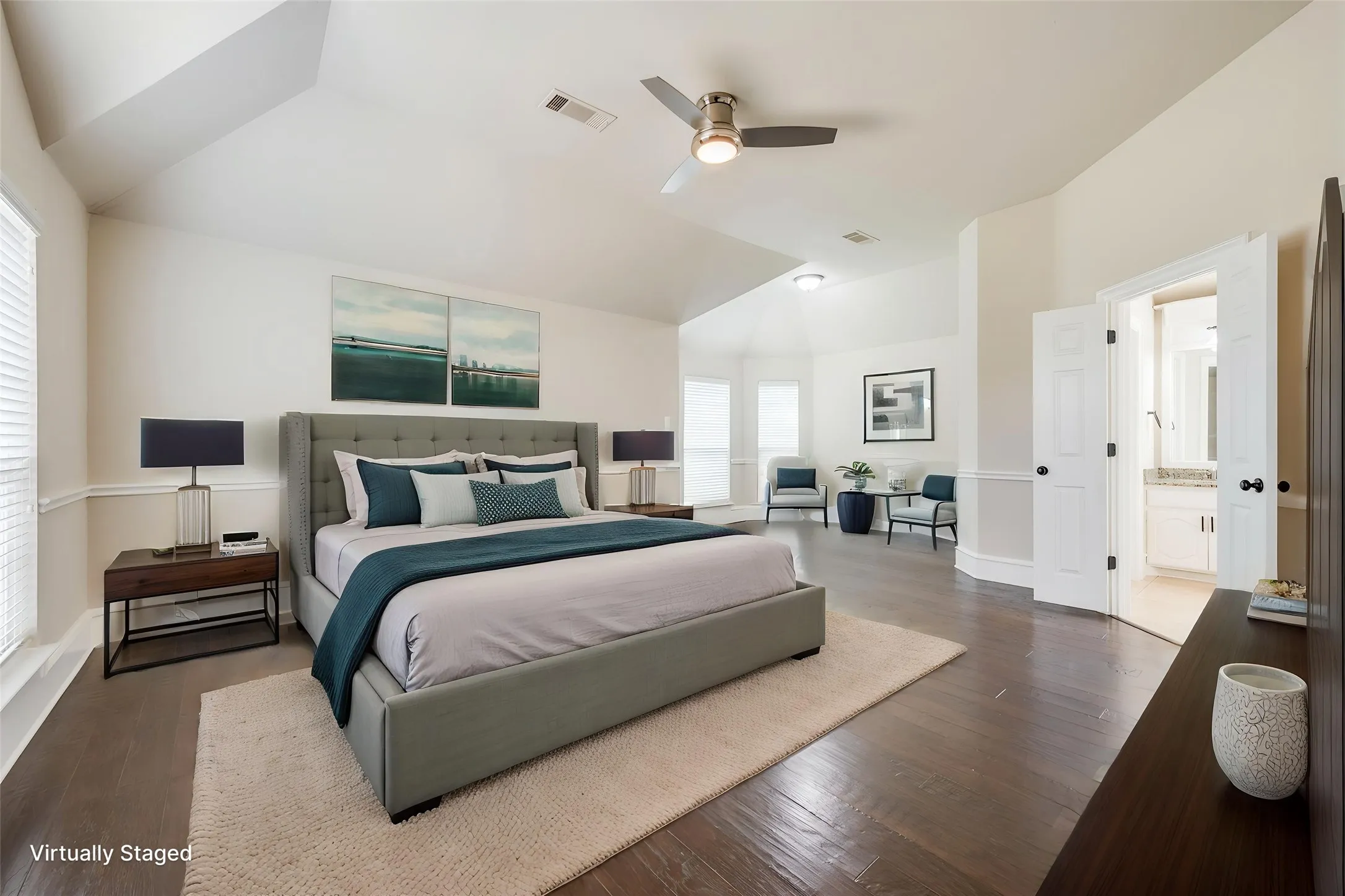 Vaulted ceiling with a ceiling fan, wood-finish flooring, and crown molding
