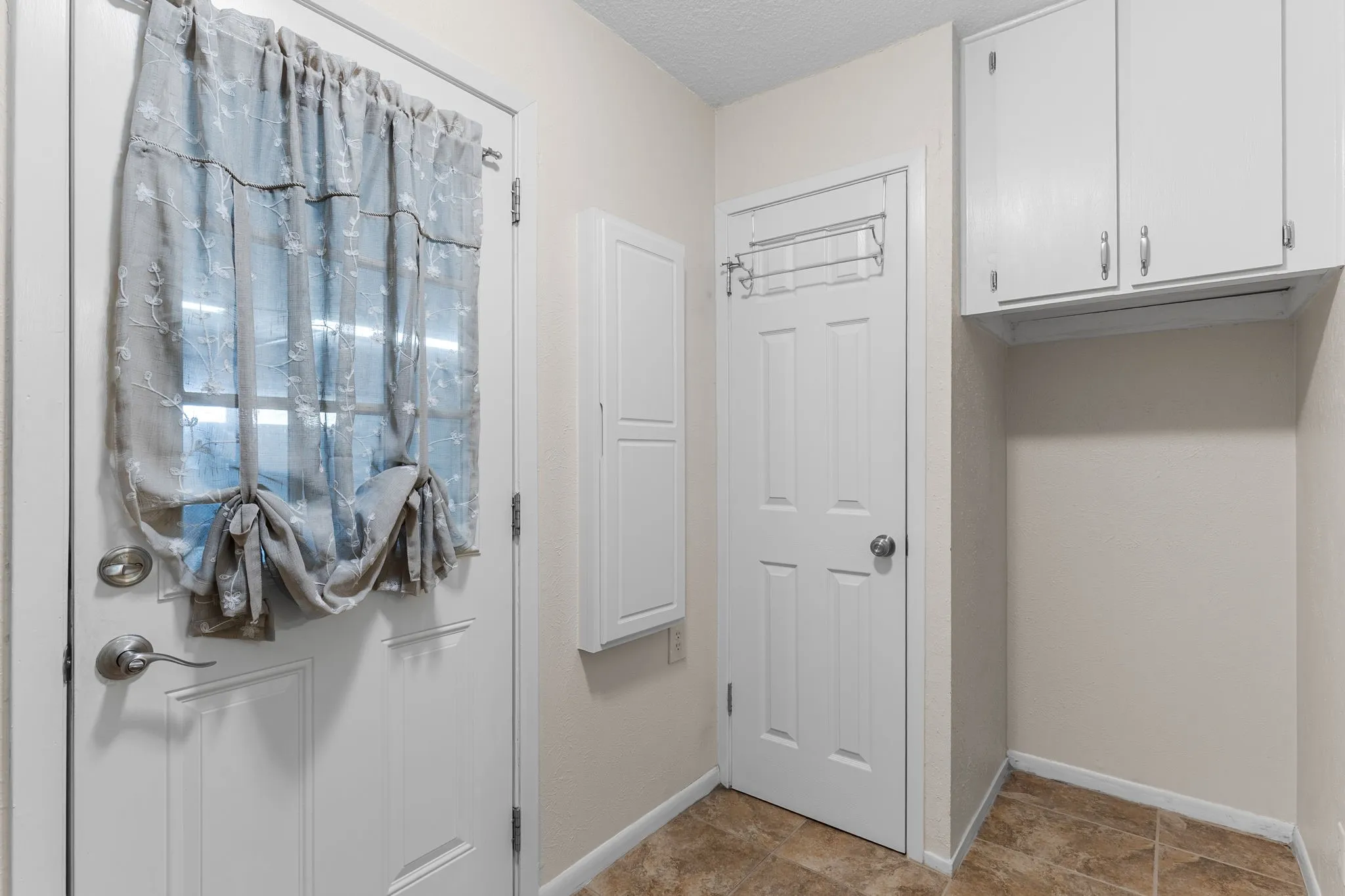 Pantry, fridge/freezer space and built in cabinets.