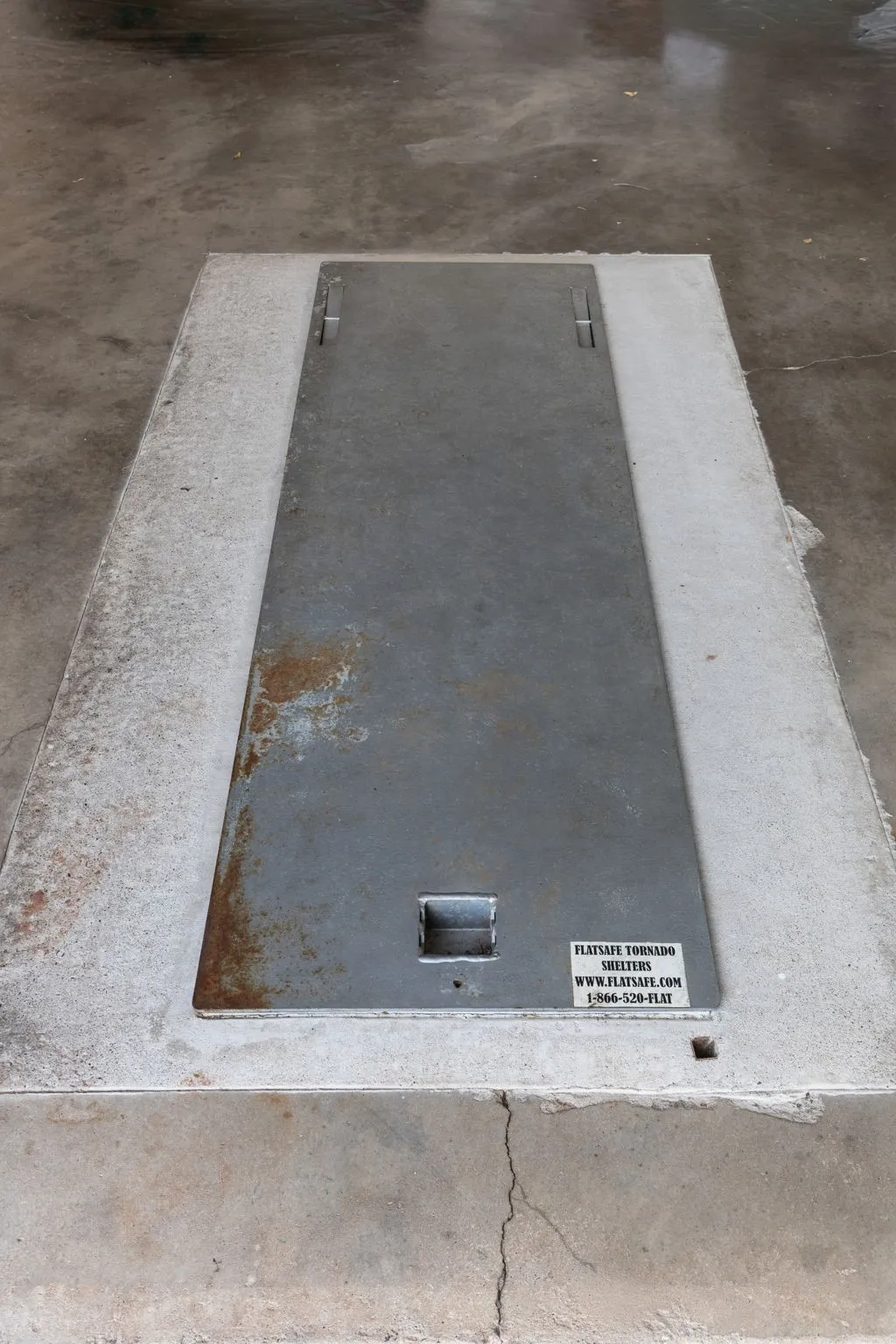 Storm cellar located in the garage floor.