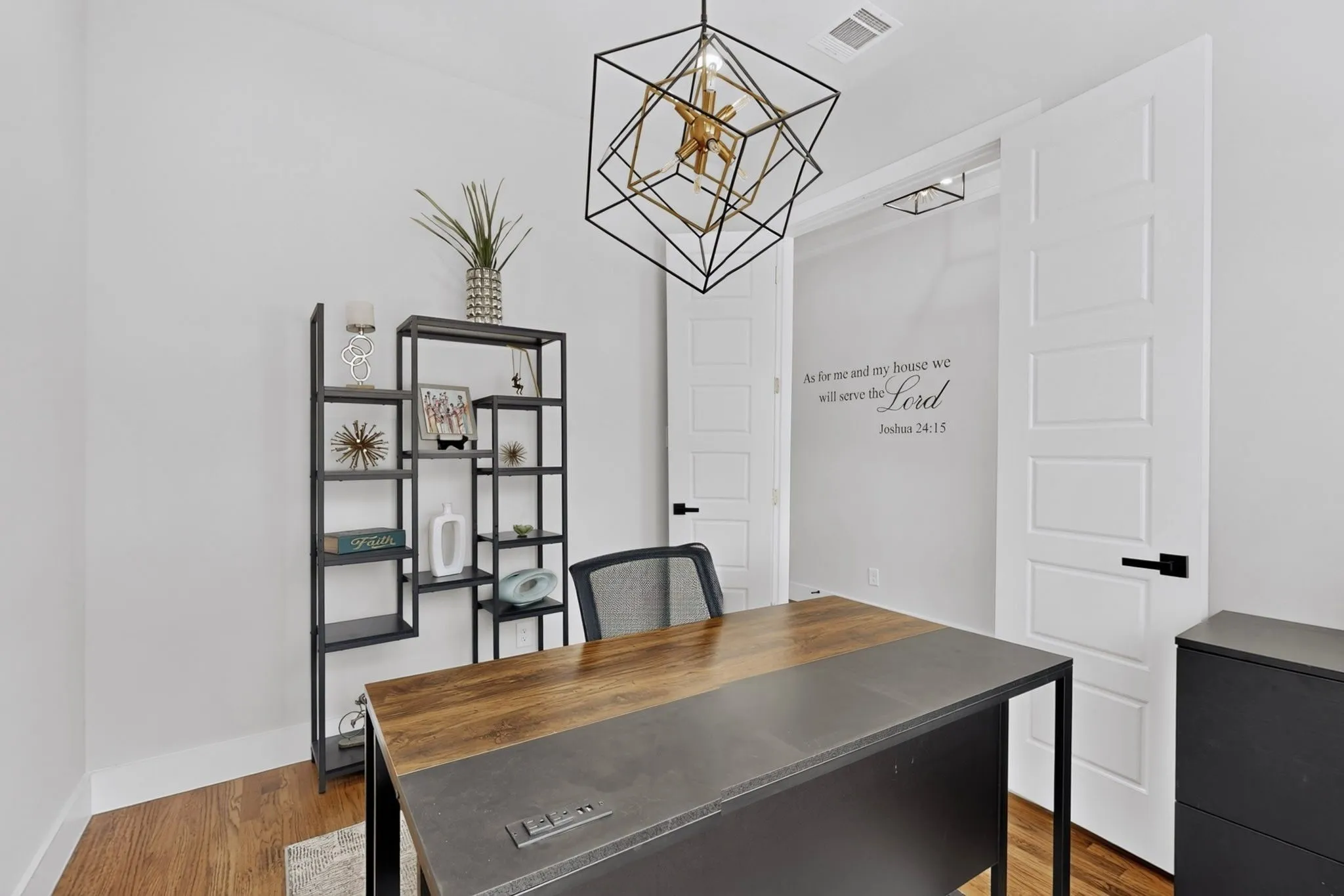 Wood-finish flooring, white walls, and a modern geometric light fixture