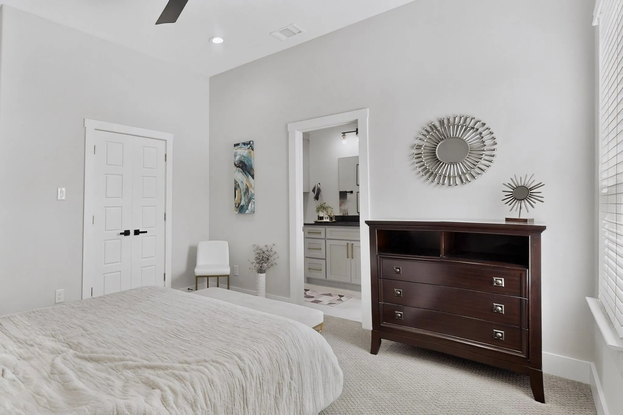 Light-toned walls, vaulted ceiling, recessed lighting, and a ceiling fan