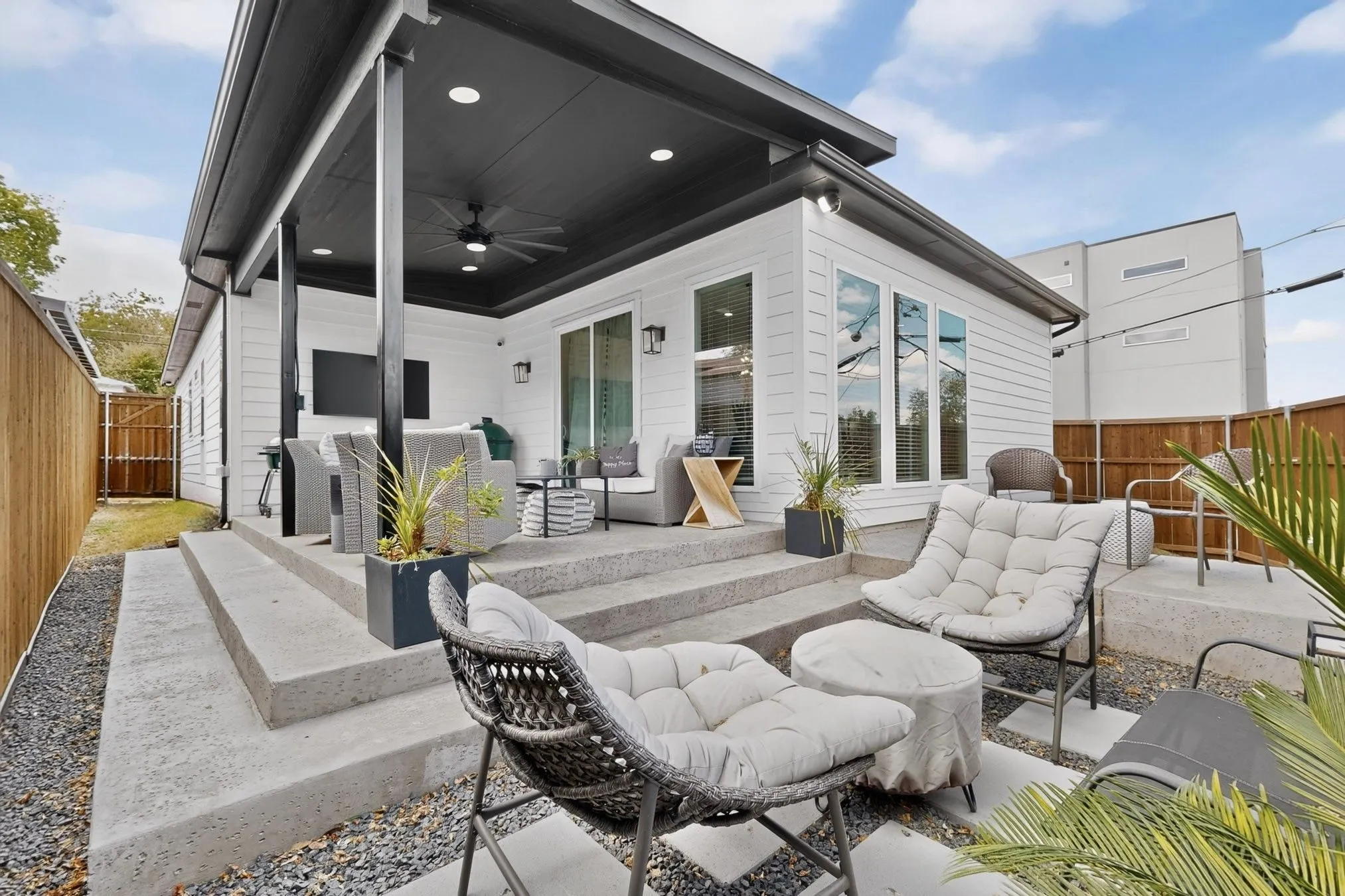 Covered patio with recessed lighting, ceiling fan, and sliding glass doors