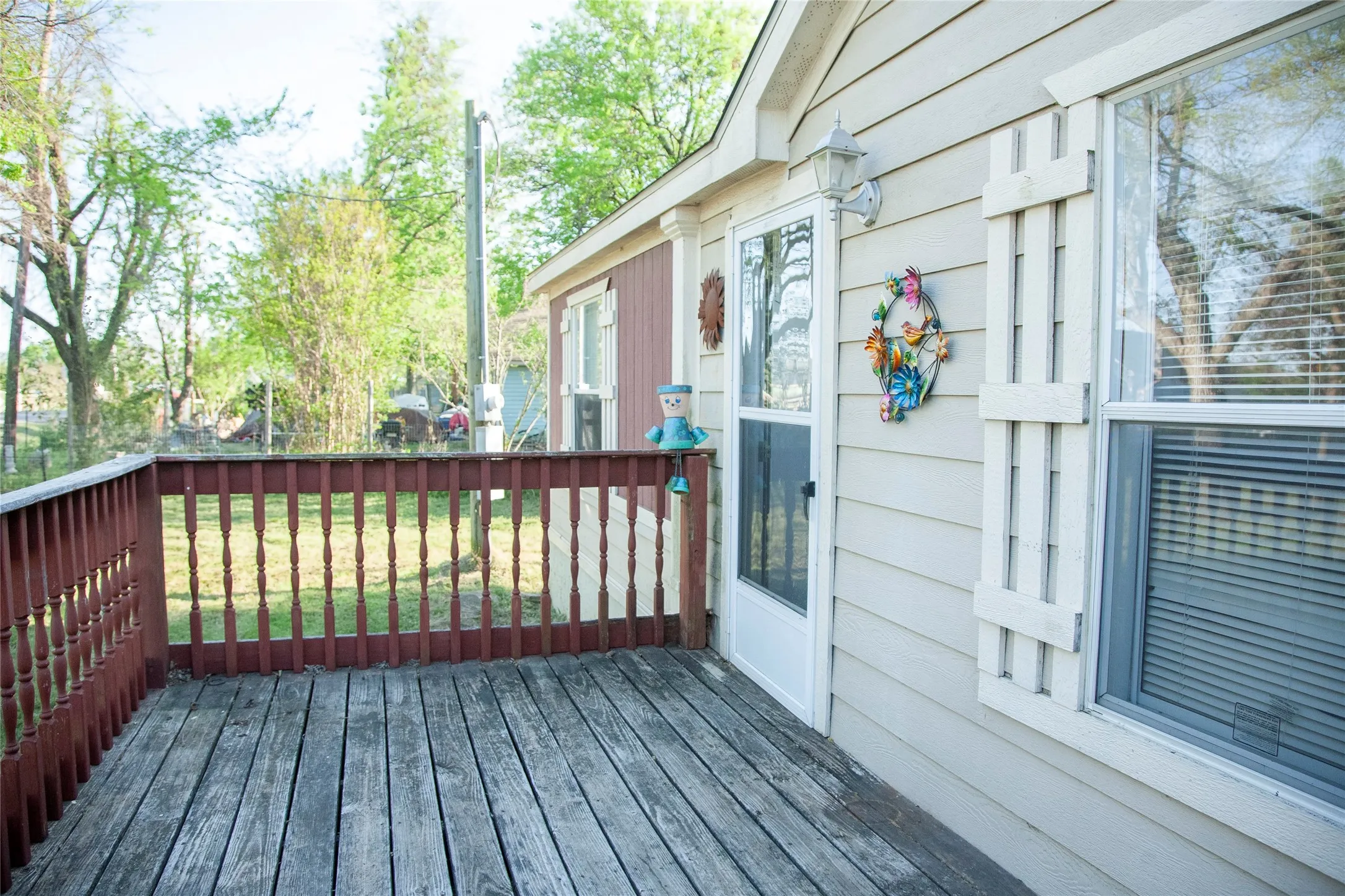 Exterior deck featuring wood flooring and a stained wood railing