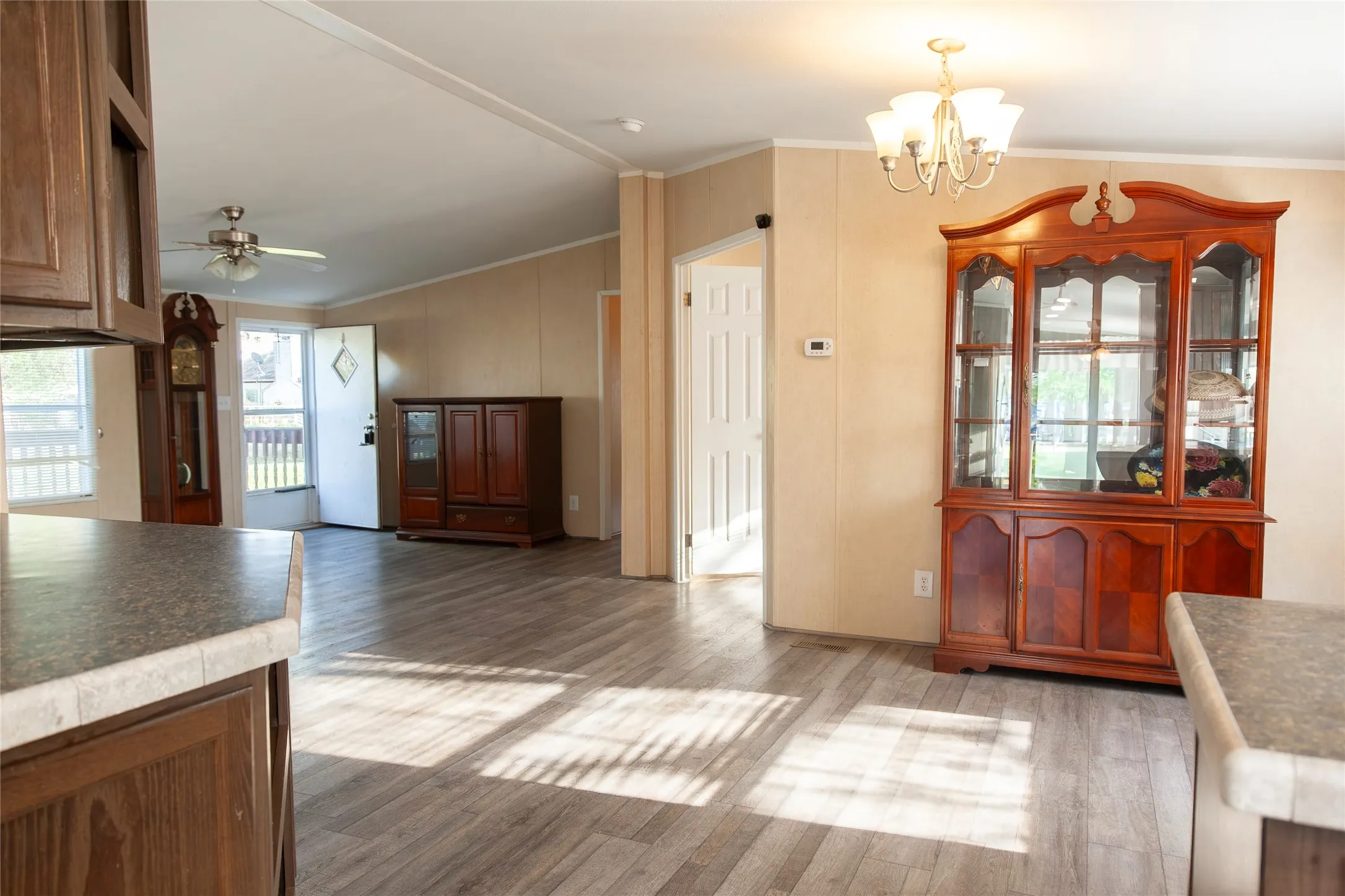 Spacious interior featuring wood-finish flooring, vaulted ceilings, and an open layout
