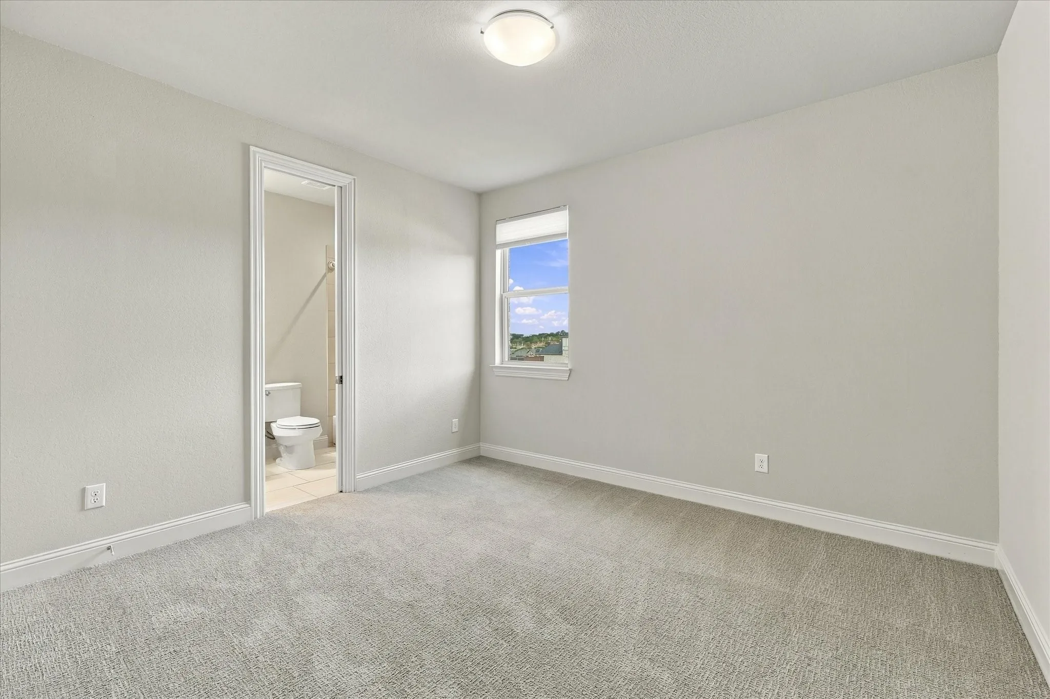 The second bedroom downstairs offers an ensuite bath