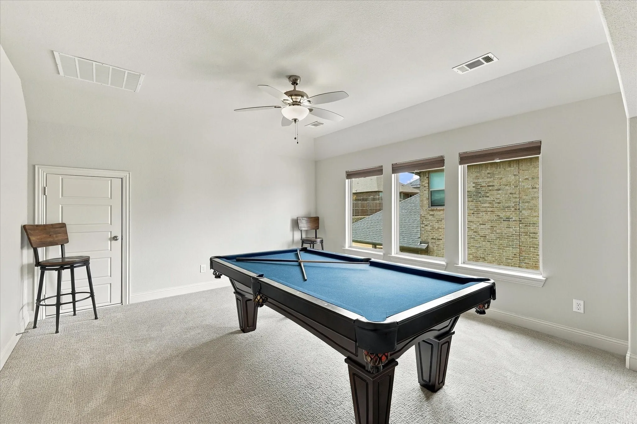 Upstairs is the complete entertainment space with game room and more
