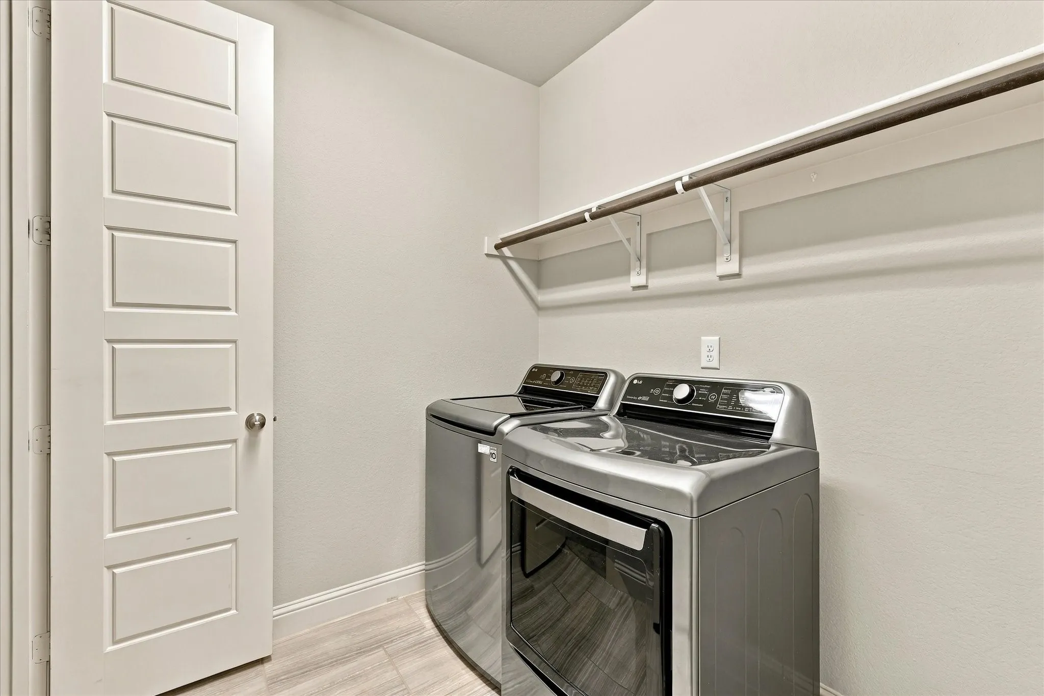The laundry room has space for your tasks and supplies