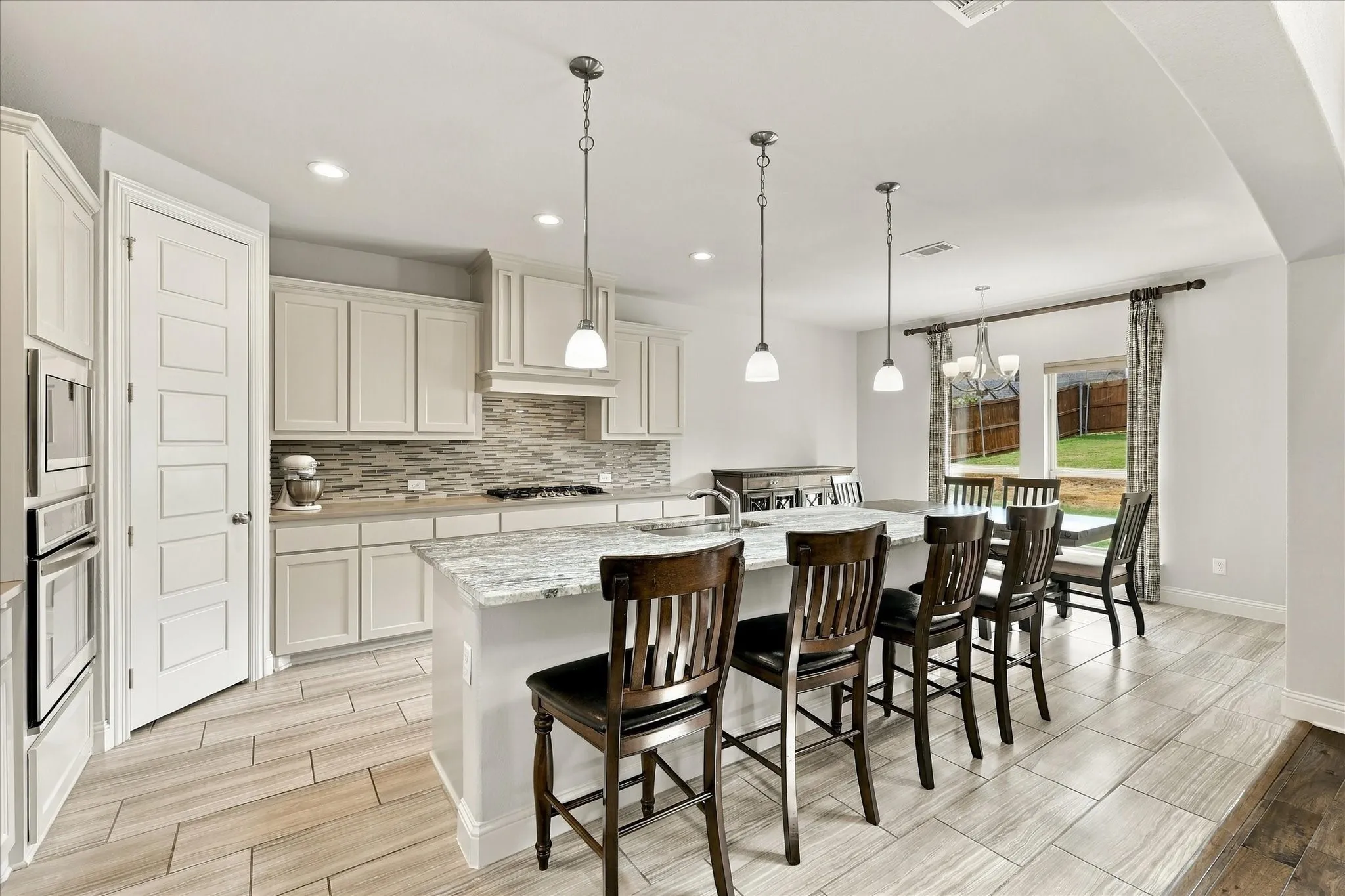 The spacious kitchen has island seating