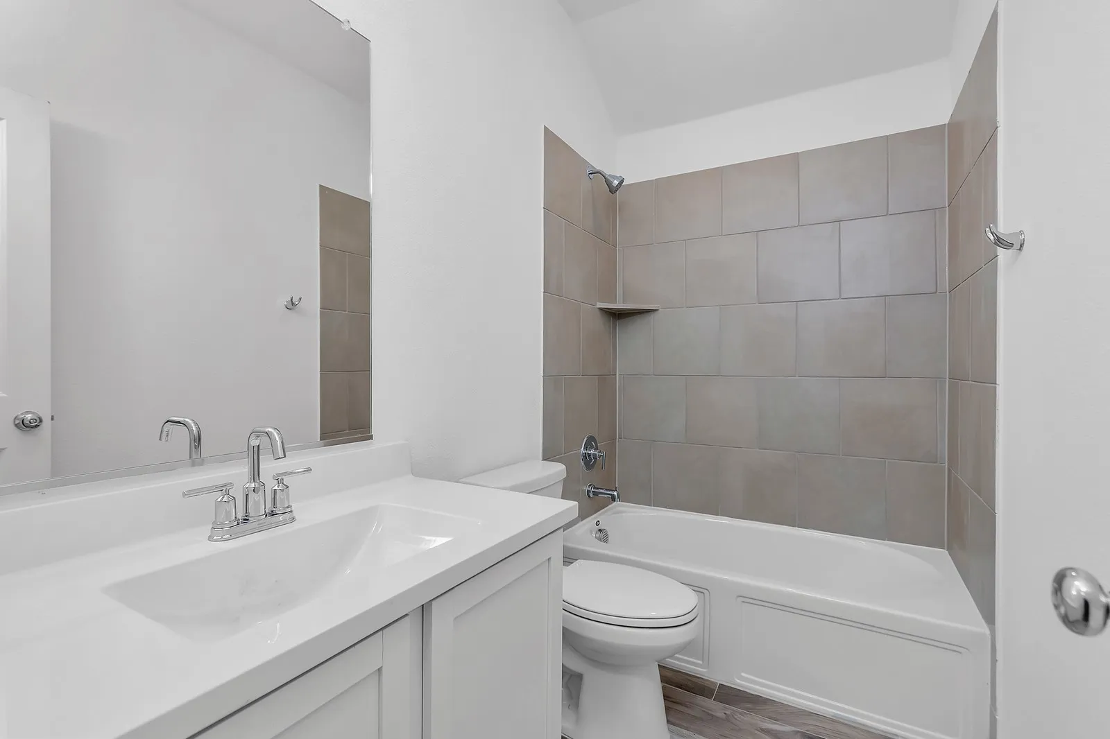Full bathroom with vanity, shower / bathtub combination, and wood finished floors