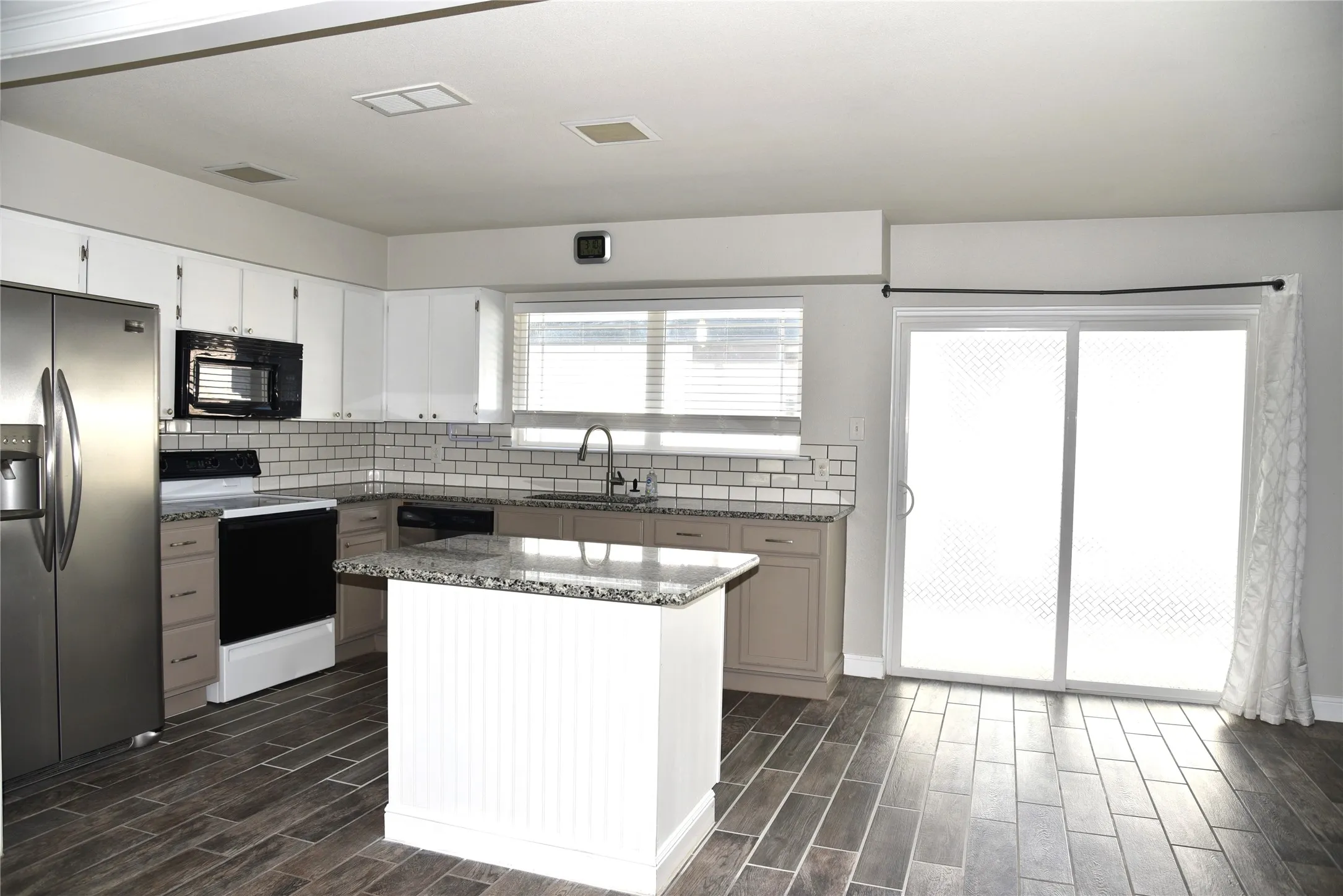 Kitchen with sliding glass door