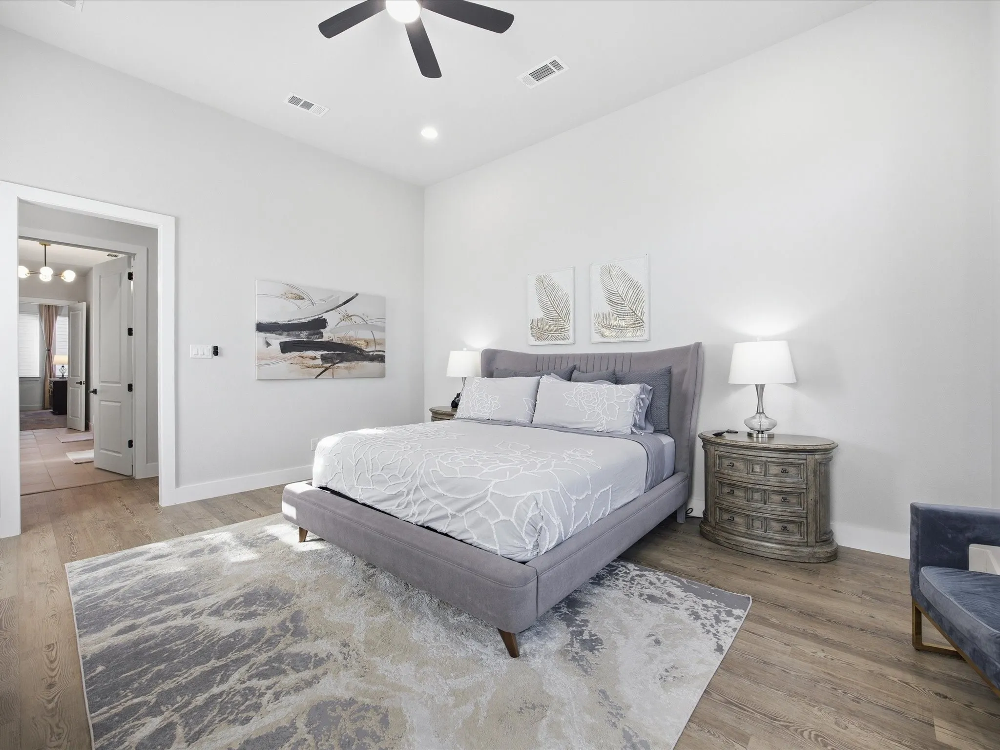 Bedroom with ceiling fan, light wood-style flooring, and recessed lighting
