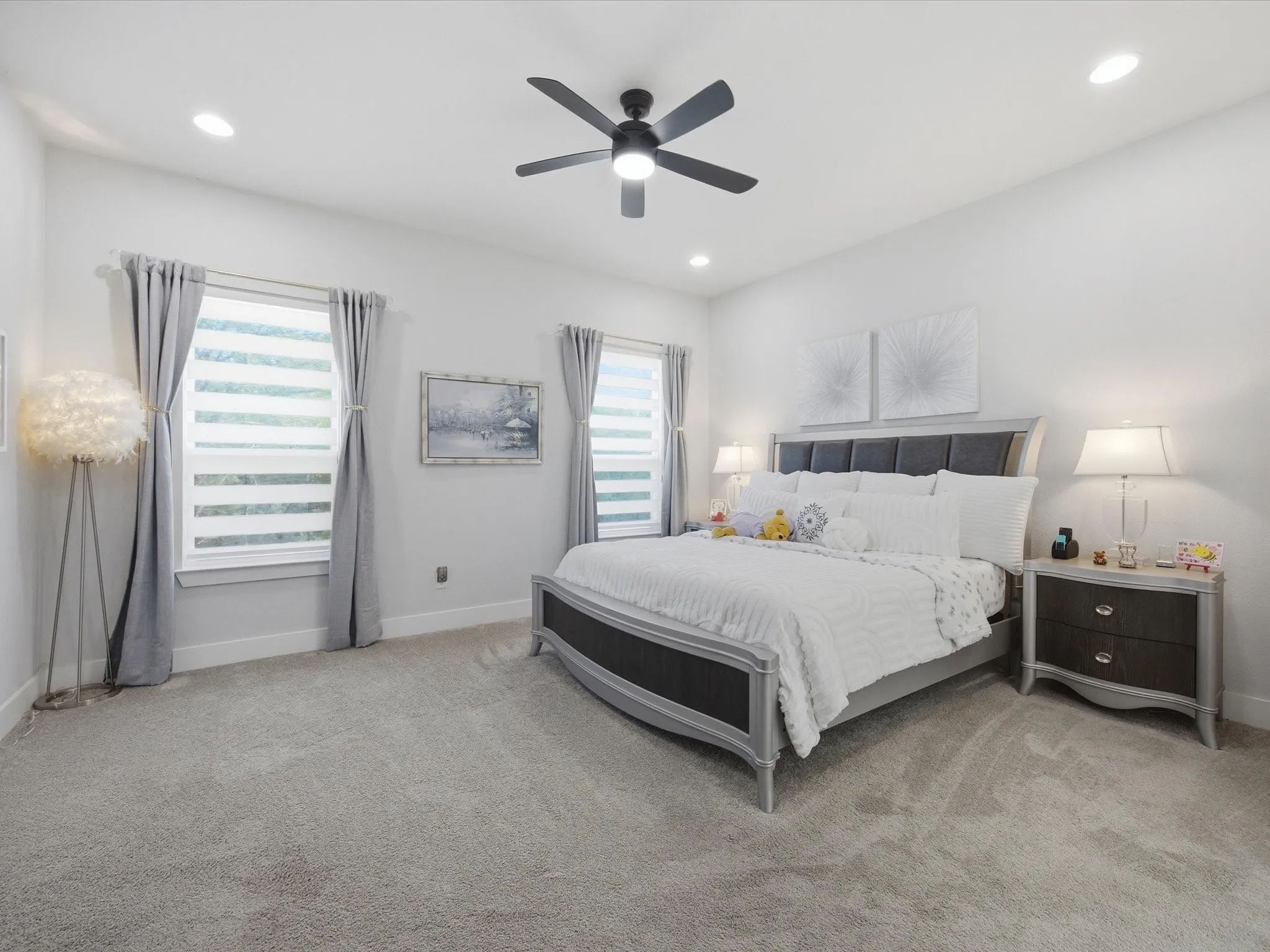 Bedroom featuring light carpet, a ceiling fan, and recessed lighting