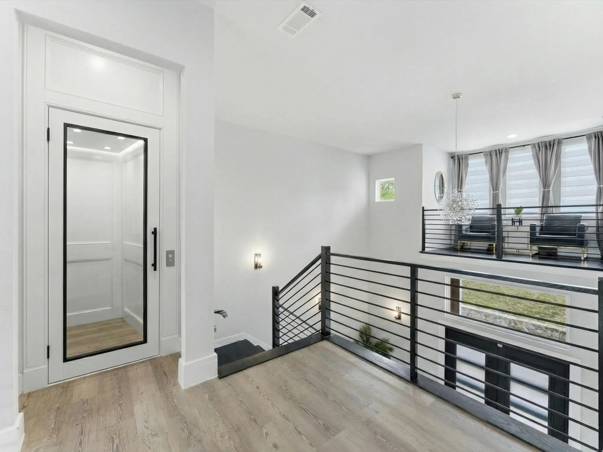 Virtually staged upstairs area where an elevator could be added.