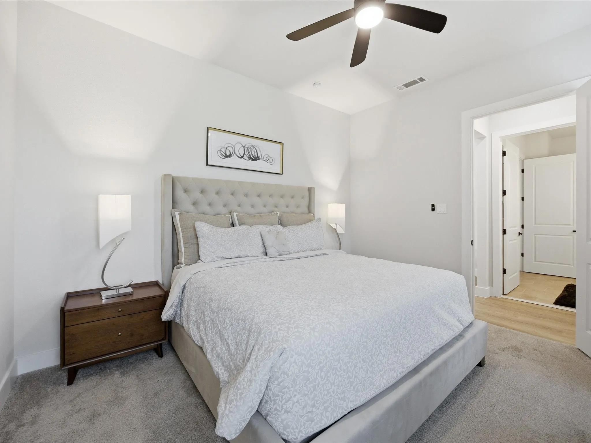 Bedroom with a ceiling fan and baseboards