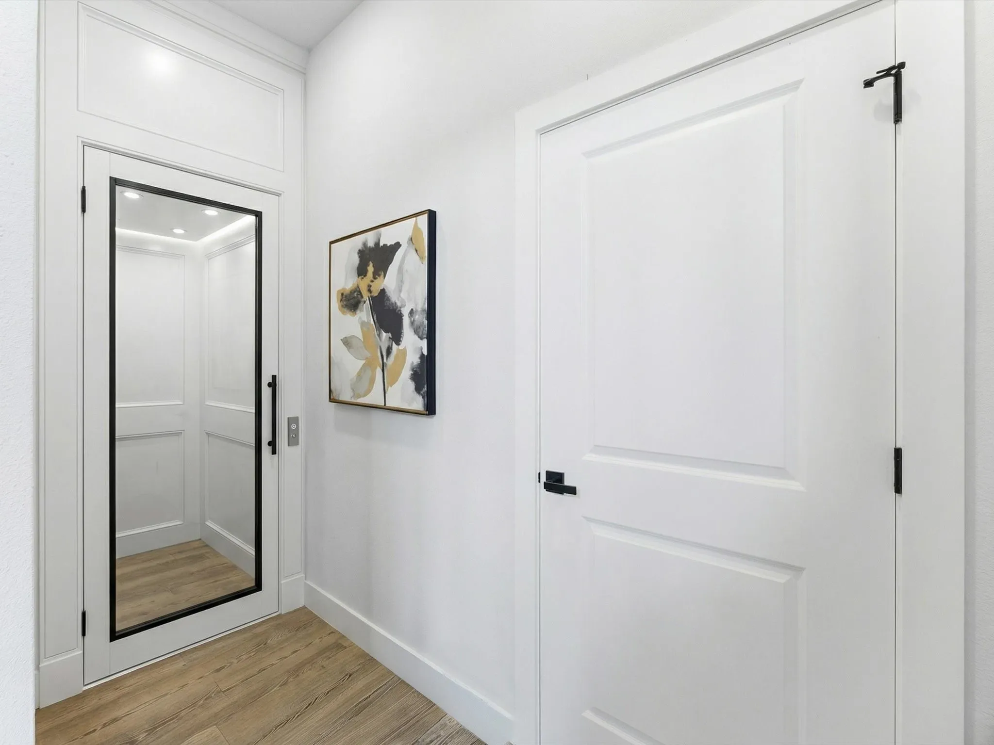 Virtually staged downstairs area off of Living Room where an elevator could be added.
