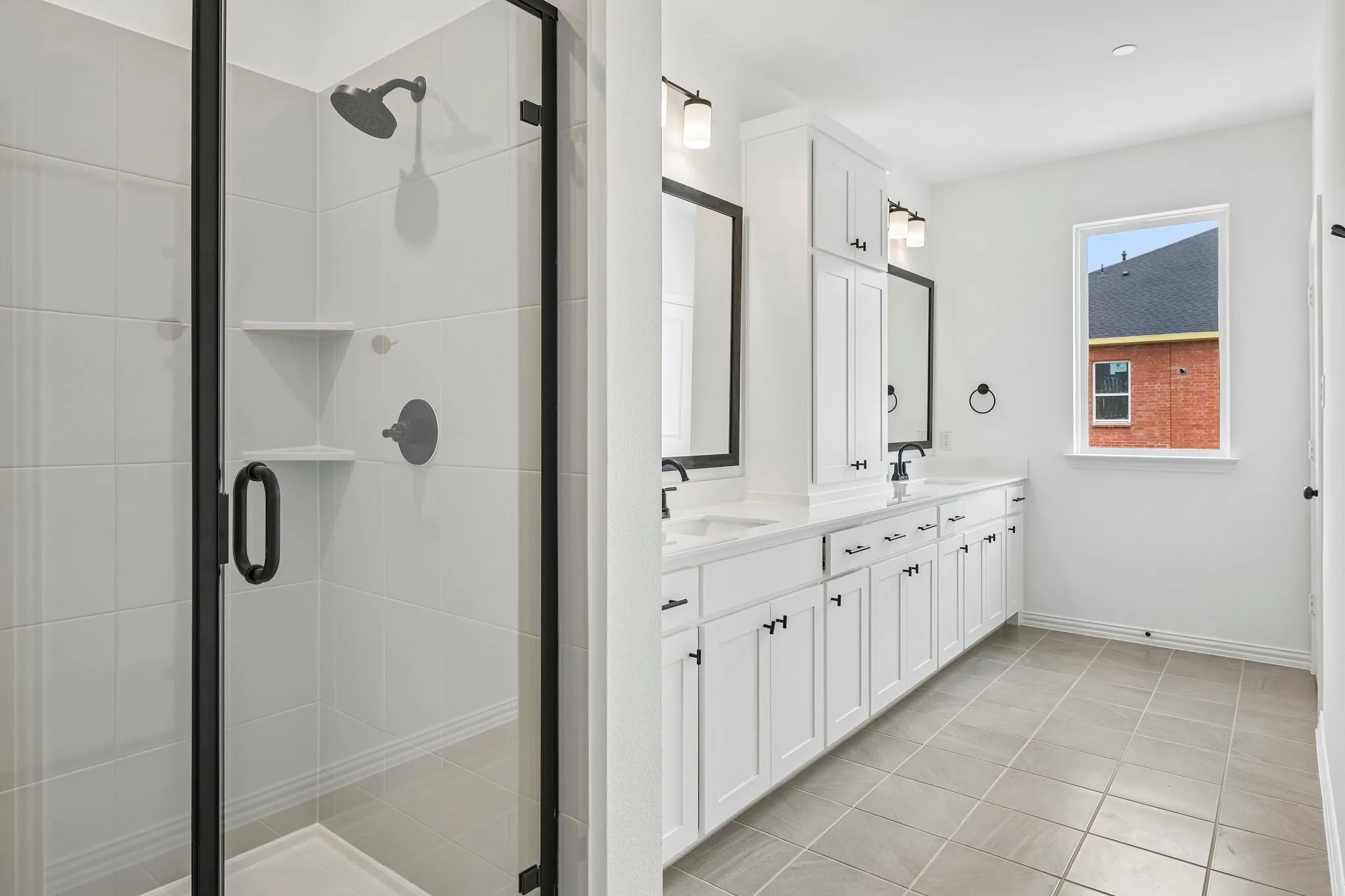 Featuring a spacious walk in shower, this owner's bath was designed with you in mind!