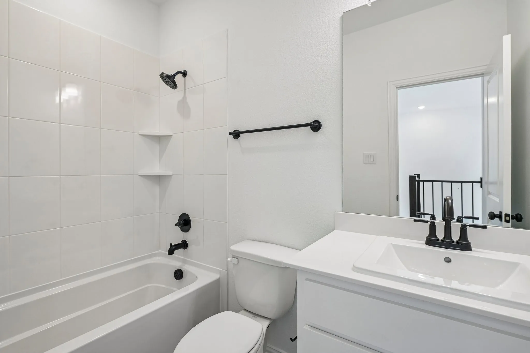 Crisp, clean and white with dark accents, this guest bath is a winner!