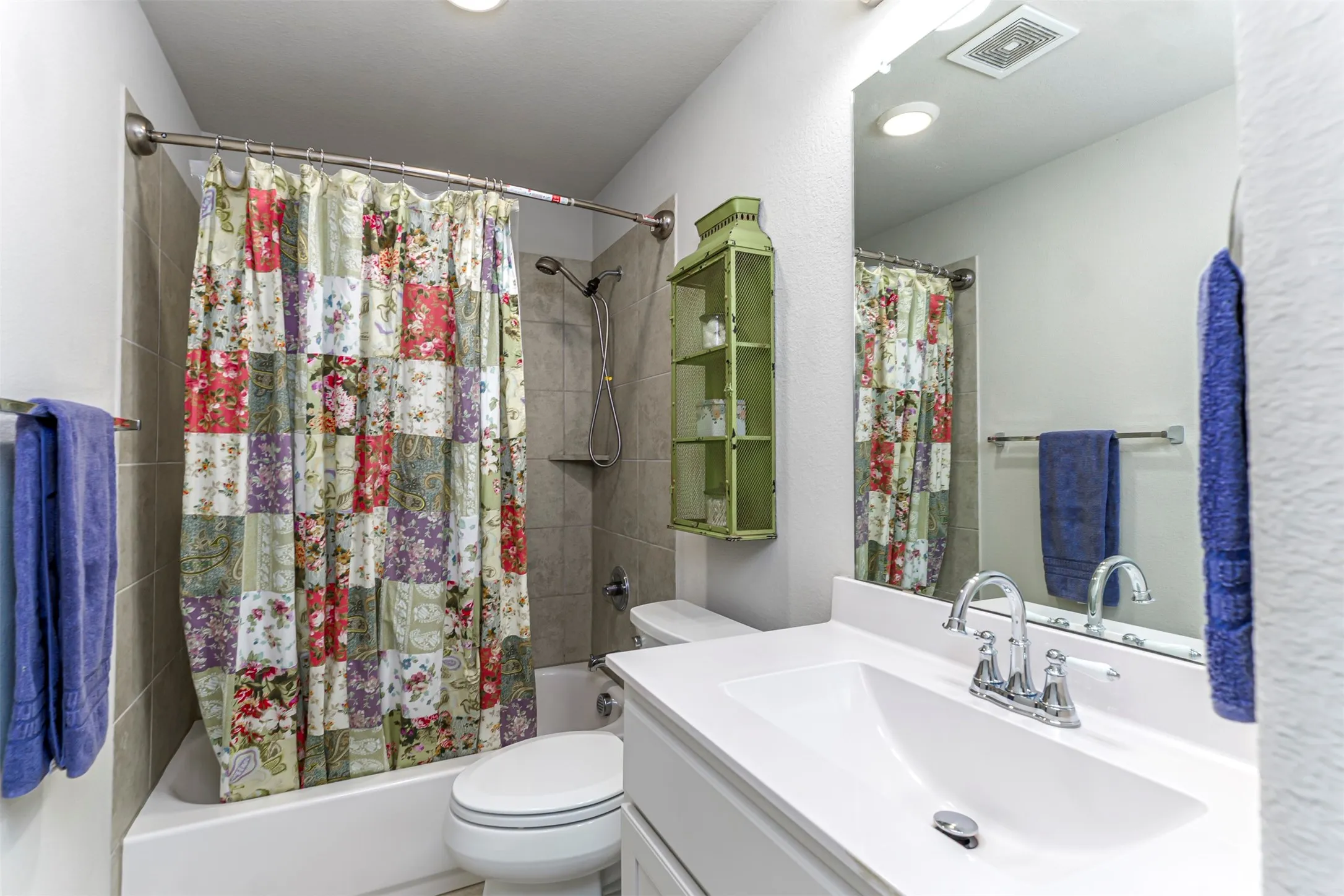 White vanity with an integrated sink and chrome faucet