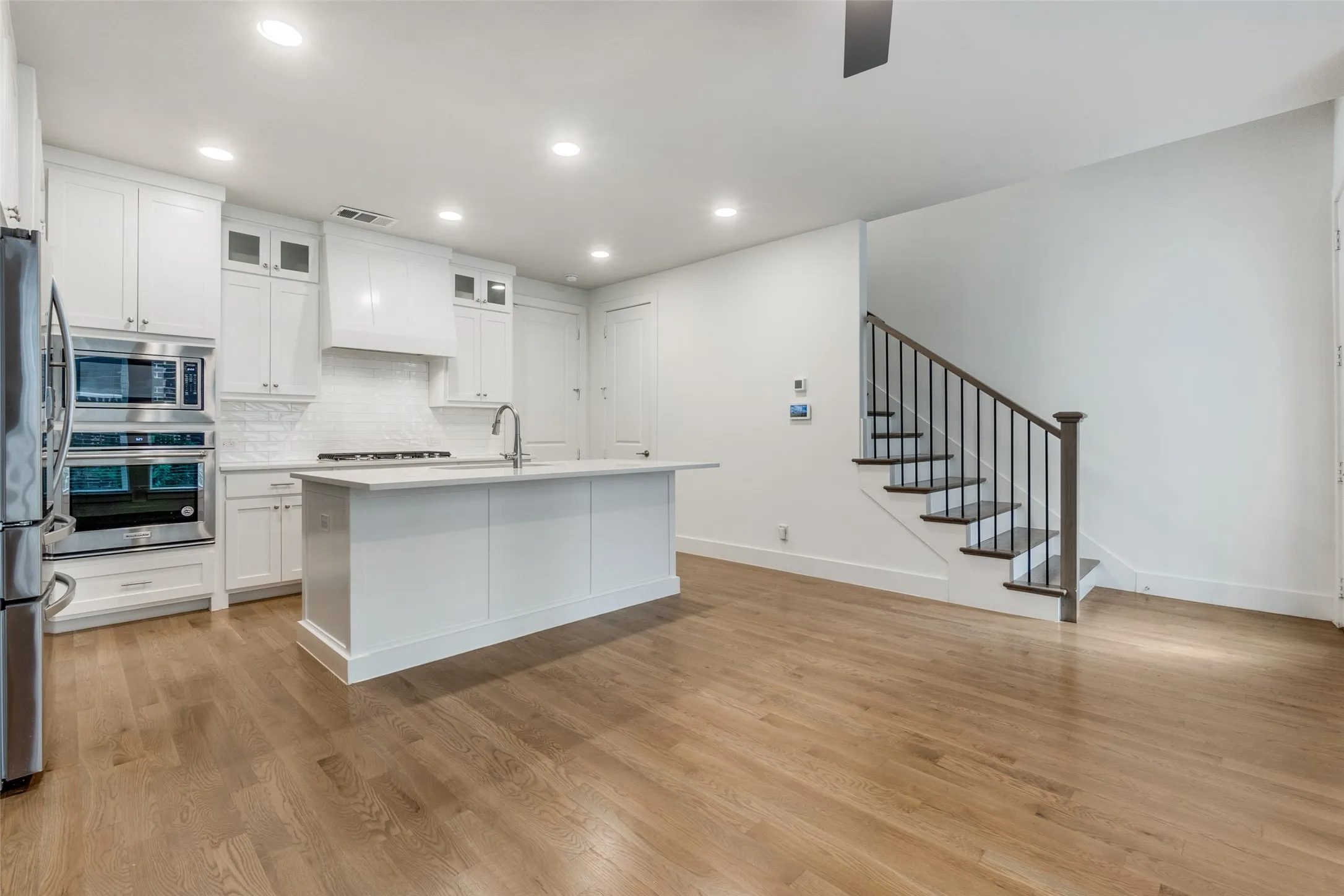 Beautiful open living space complete with half bath just off kitchen.