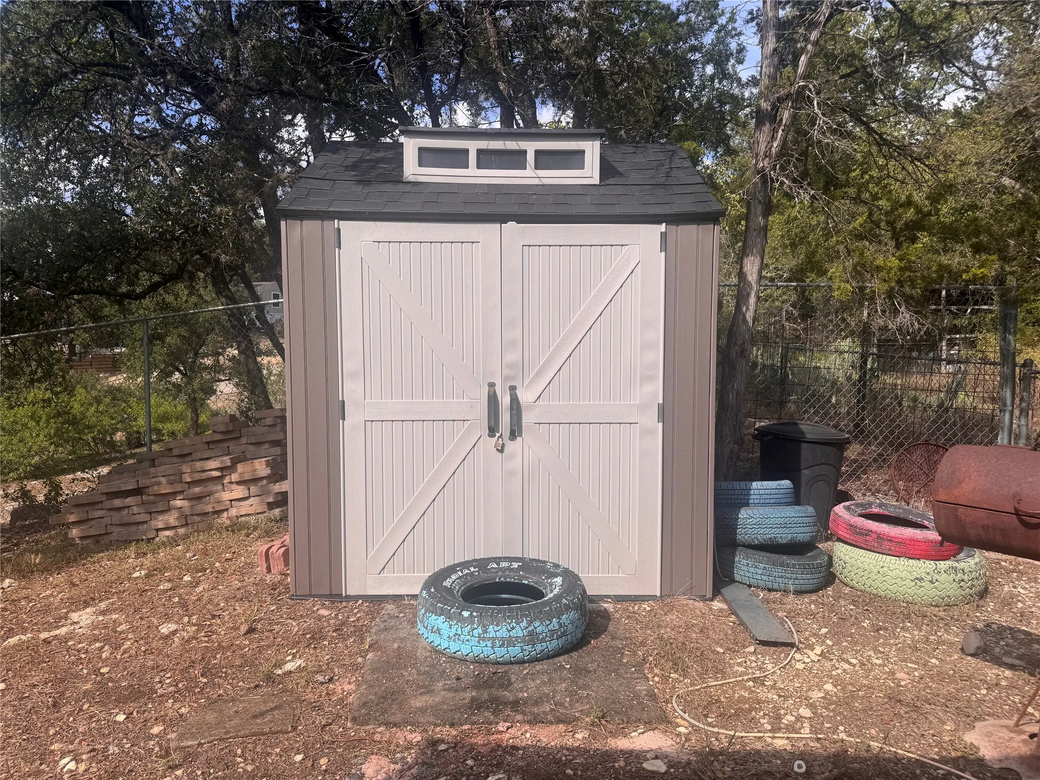 Storage shed that currently houses an outdoor kitchen.