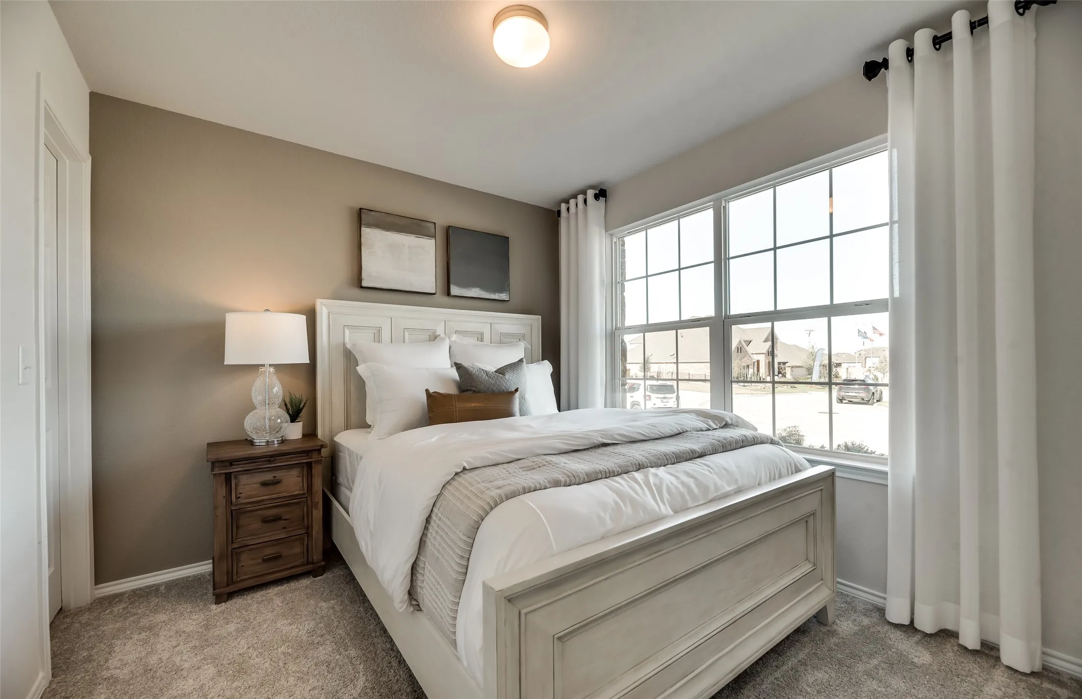 *Model Representation - Spacious secondary bedroom with large windows