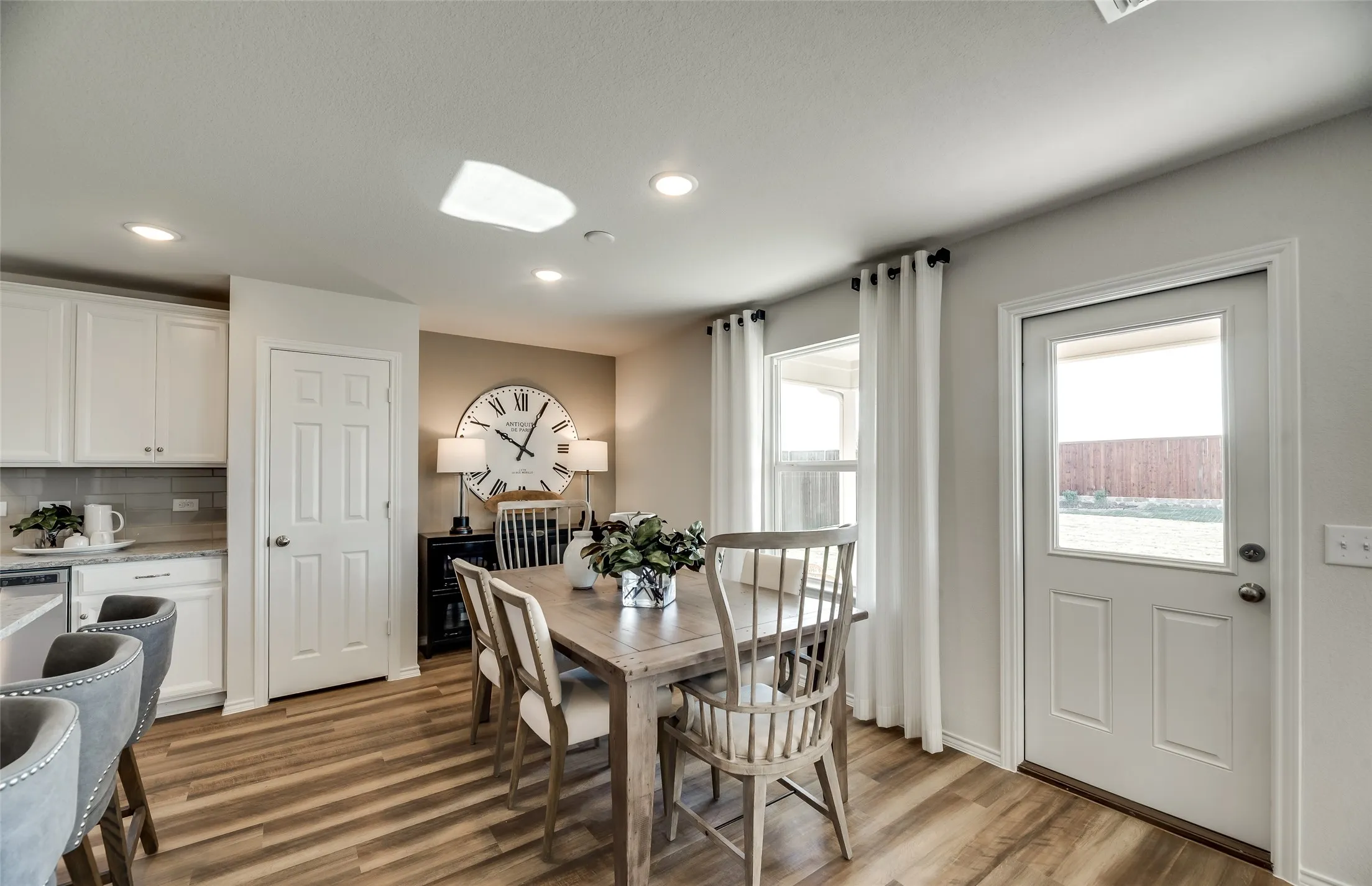 *Model Representation - Dining area off kitchen with large windows