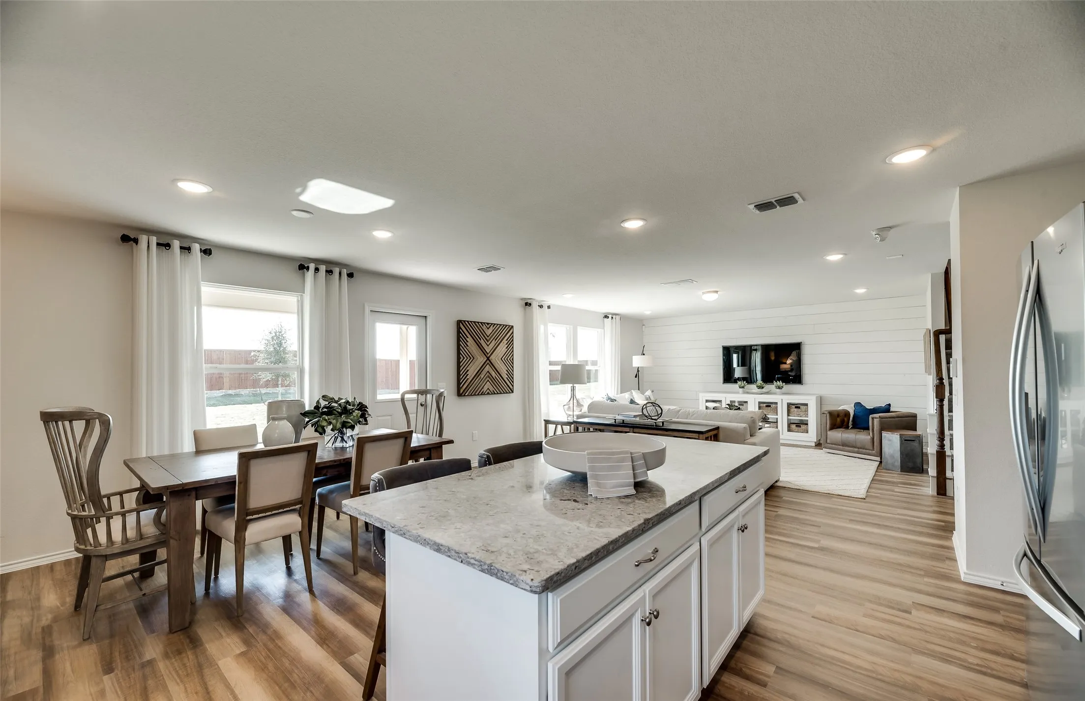 *Model Representation - Large island overlooking gathering room and dining areas