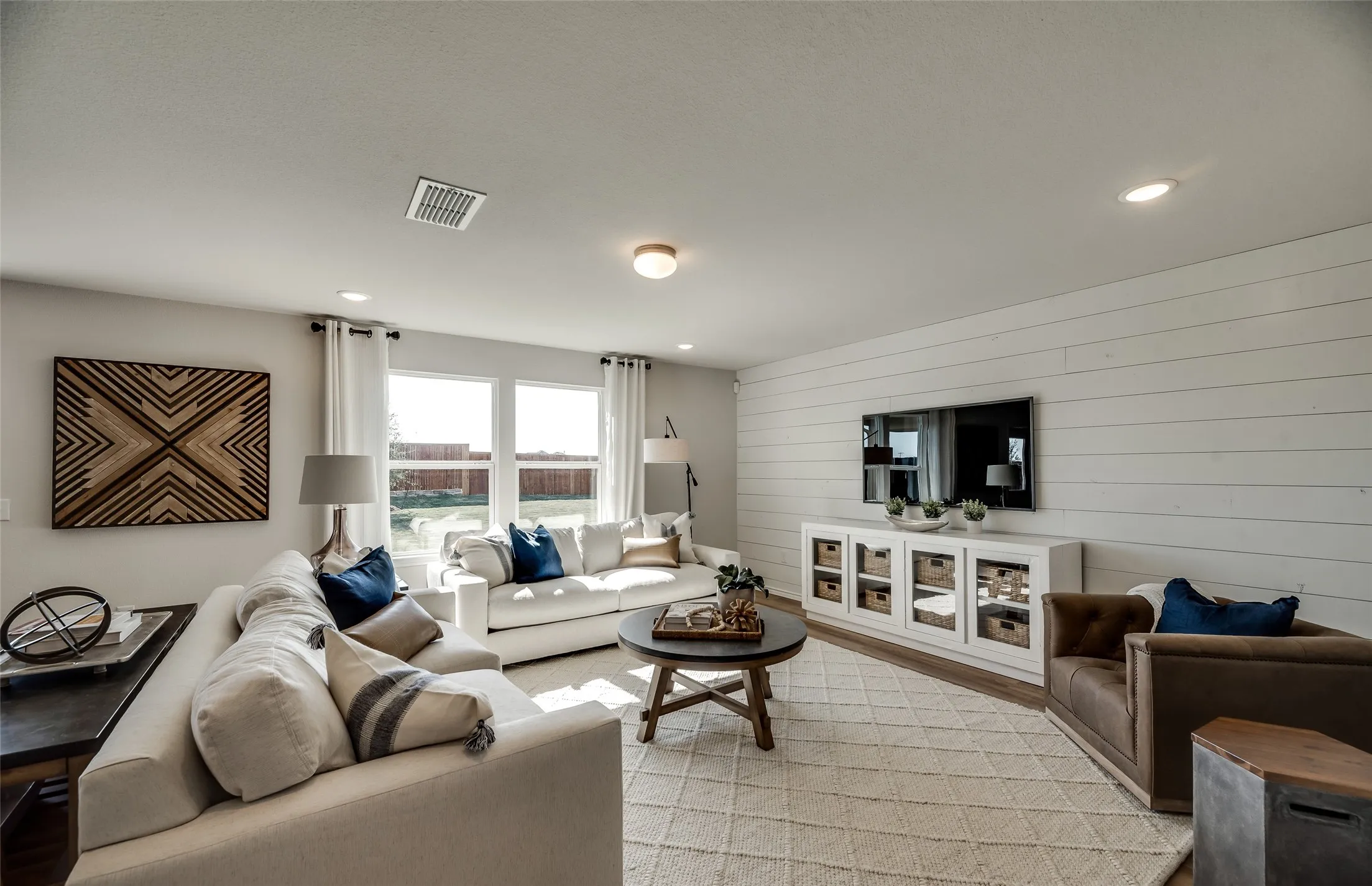*Model Representation - Spacious gathering room with large windows