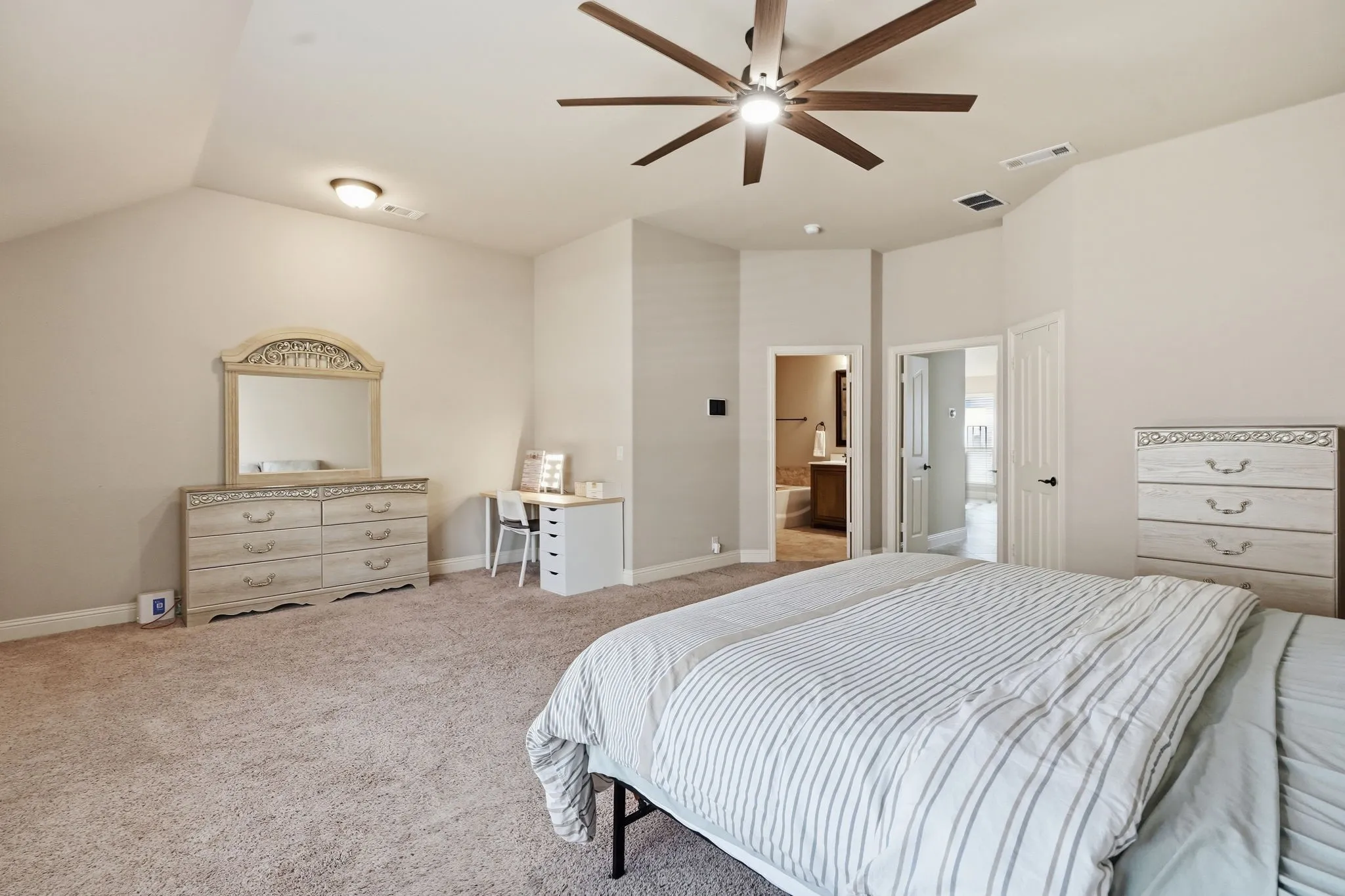 Recessed lighting, sloped ceiling, and a ceiling fan with integrated lighting